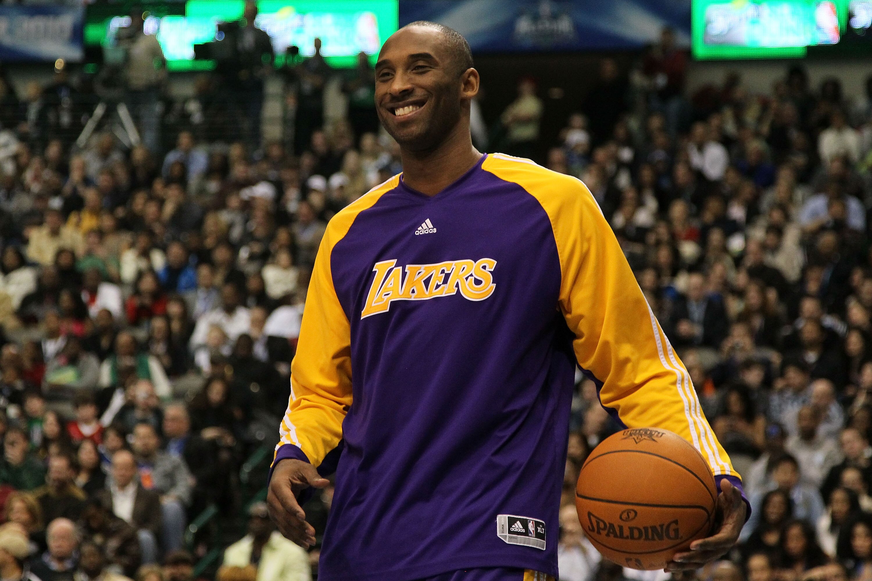 DALLAS - FEBRUARY 13:  Kobe Bryant #24 of the Los Angeles Lakers smiles while on court to assist teammate Shannon Brown #12 during the Sprite Slam Dunk Contest on All-Star Saturday Night, part of 2010 NBA All-Star Weekend at American Airlines Center on Fe