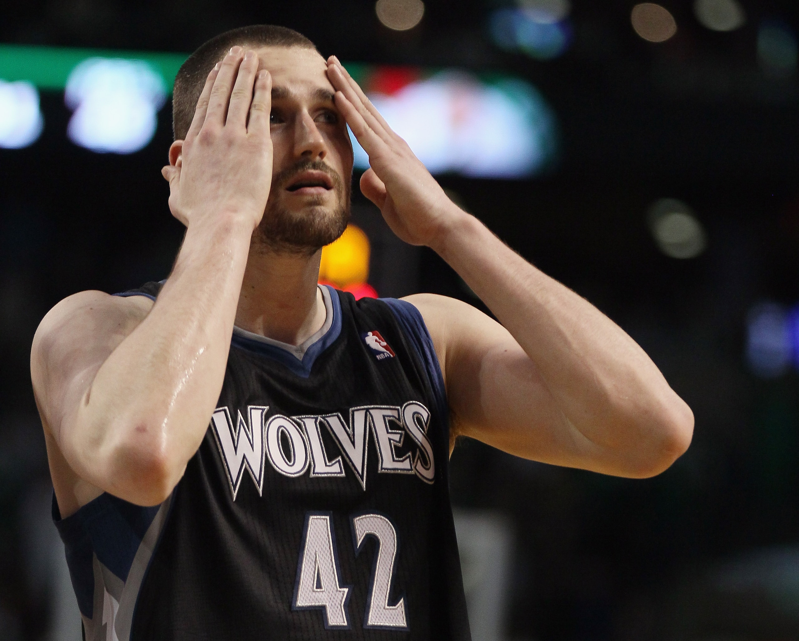 BOSTON, MA - JANUARY 03:  Kevin Love #42 of the Minnesota Timberwolves wipes his face in the fourth quarter against the Boston Celtics on January 3, 2011 at the TD Garden in Boston, Massachusetts. The Celtics defeated the Timberwolves 96-93. NOTE TO USER: