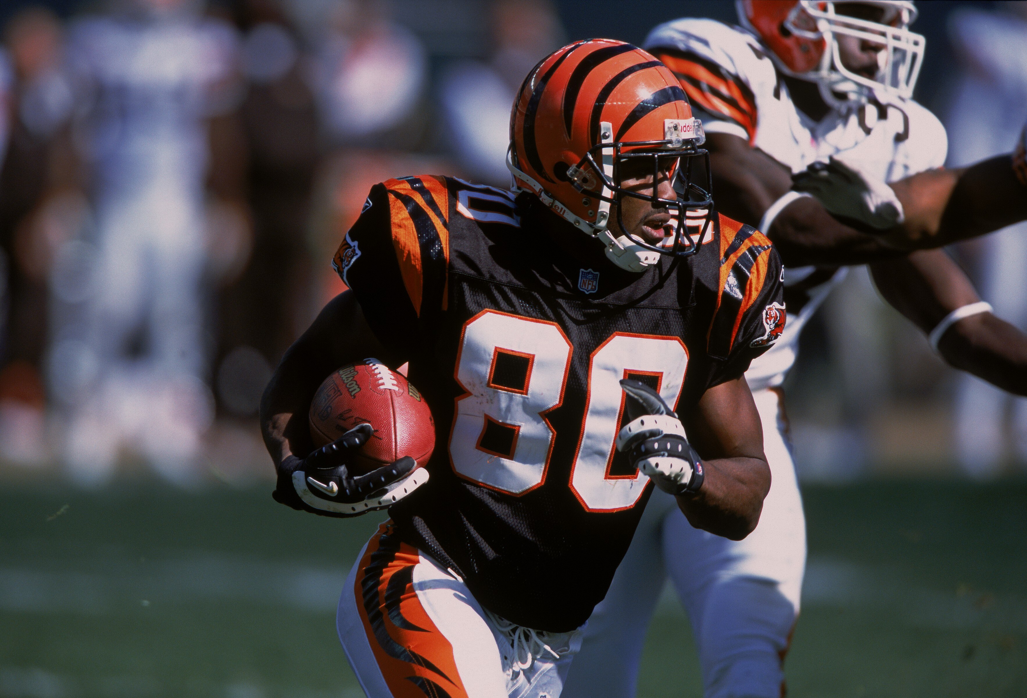 14 Oct 2001:  Peter Warrick #80 of the Cincinnati Bengels carries the ball during the game against the Cleveland Browns at Paul Brown Stadium in Cincinnati, Ohio. The Bengals defeated the Browns 24-14.Mandatory Credit: Tom Pidgeon  /Allsport