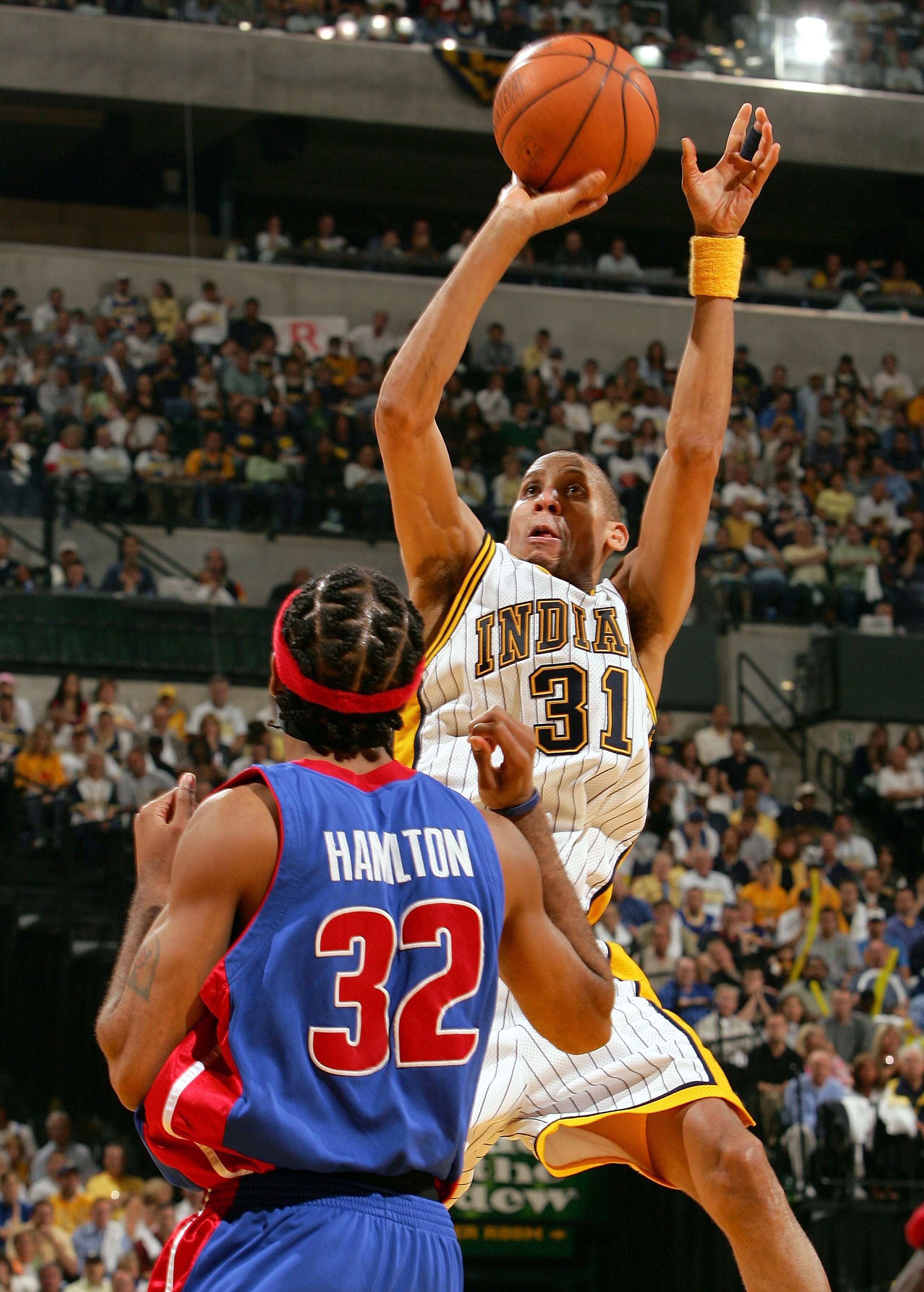 INDIANAPOLIS - MAY 13:  Reggie Miller #31 of the Indiana Pacers shoots over Richard Hamilton #32 of the Detroit Pistons in Game three of the Eastern Conference Semifinals during the 2005 NBA Playoffs at Conseco Fieldhouse on May 13, 2005 in Indianapolis, 