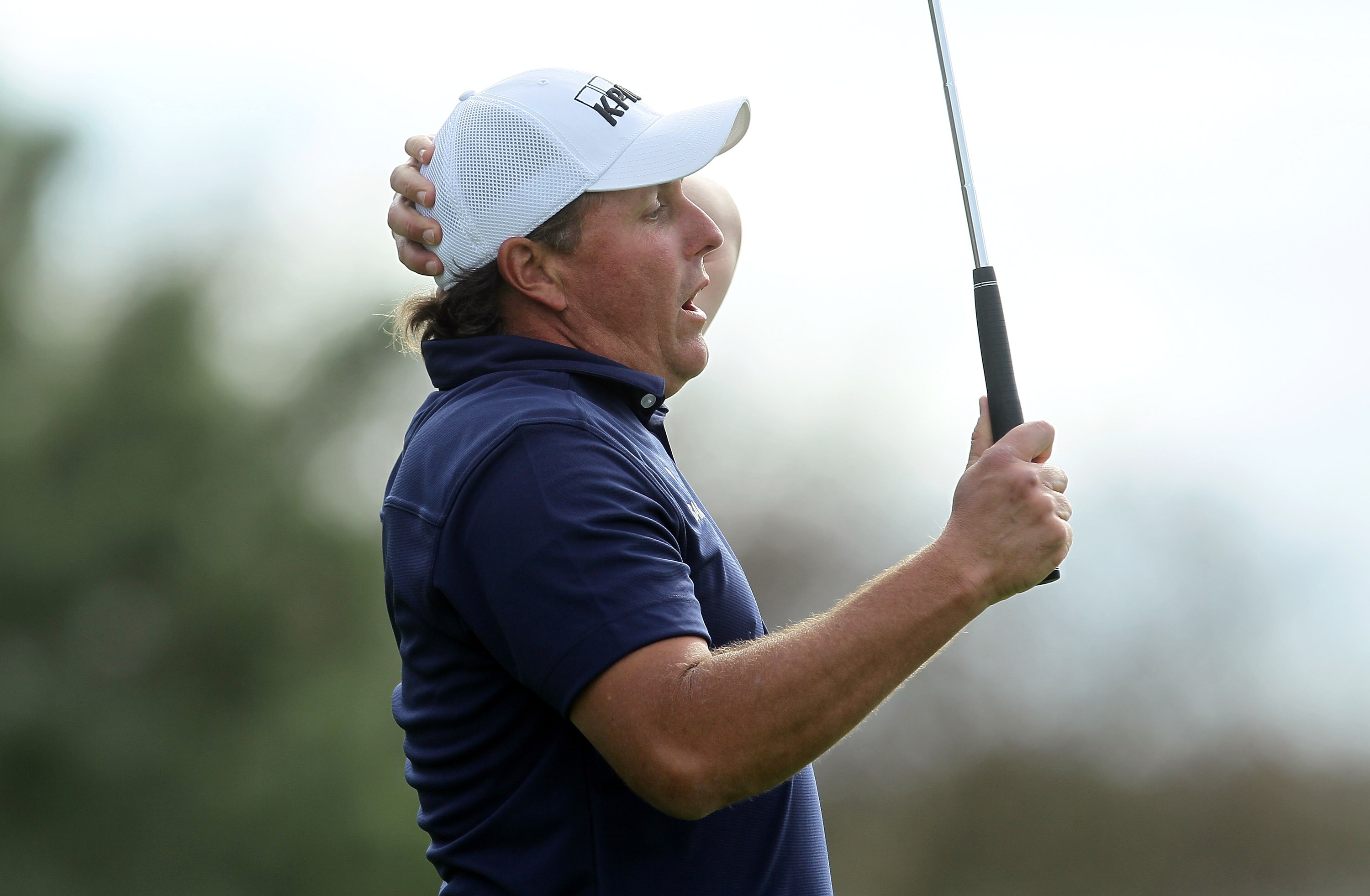 LA JOLLA, CA - JANUARY 30:  Phil Mickelson reacts after just missing an eagle putt attempt on the 13th hole during the final round of the Farmers Insurance Open at Torrey Pines South Course on January 30, 2011 in La Jolla, California.  (Photo by Stephen D