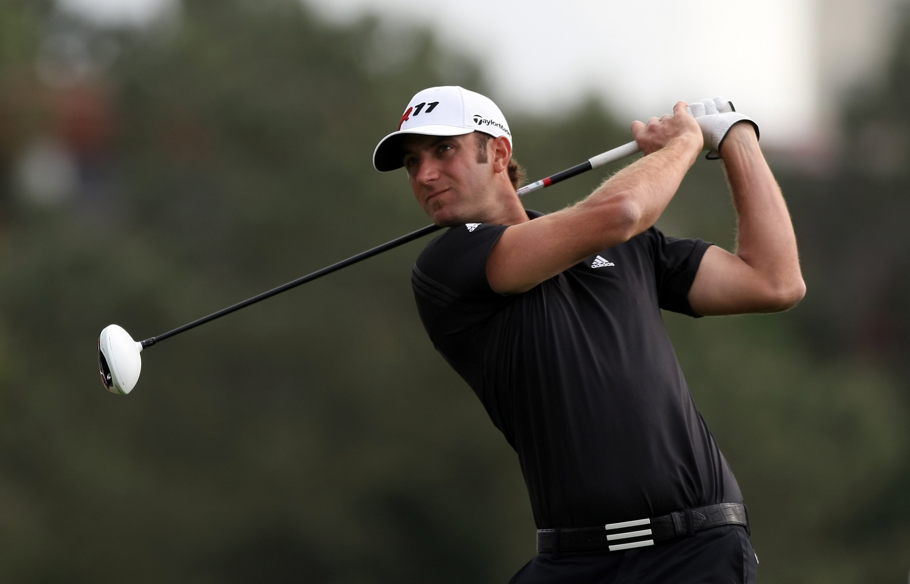 LA JOLLA, CA - JANUARY 30:  Dustin Johnson tees off the 18th hole during the final round of the Farmers Insurance Open on January 30, 2011 in La Jolla, California.  (Photo by Donald Miralle/Getty Images)