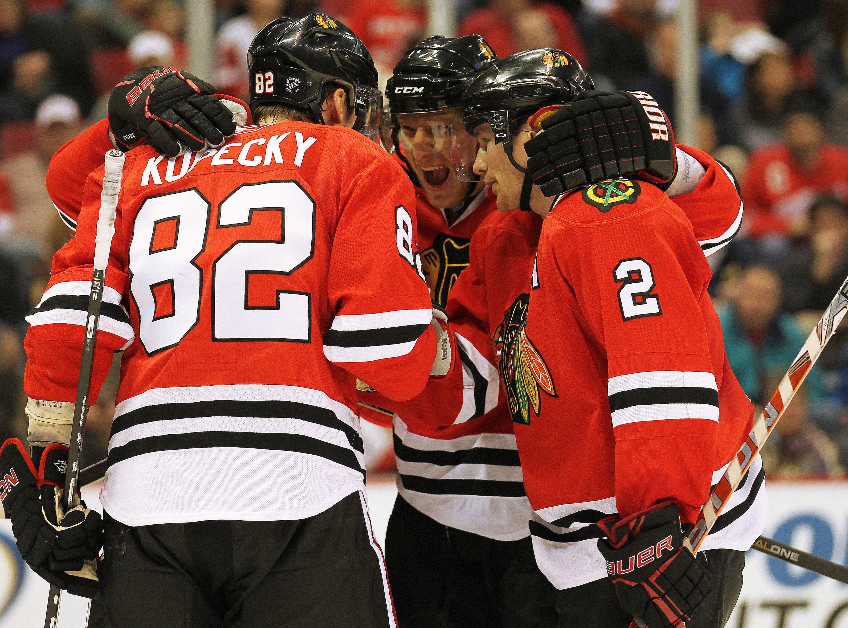 DETROIT, MI - JANUARY 22:  Tomas Kopecky #82 of the Chicago Black Hawks celebrates his goal with teammates Marian Hossa #81 and Duncan Keith #2 in a game against the Detroit Red Wings on January 22, 2011 at the Joe Louis Arena in Detroit, Michigan. The Ha