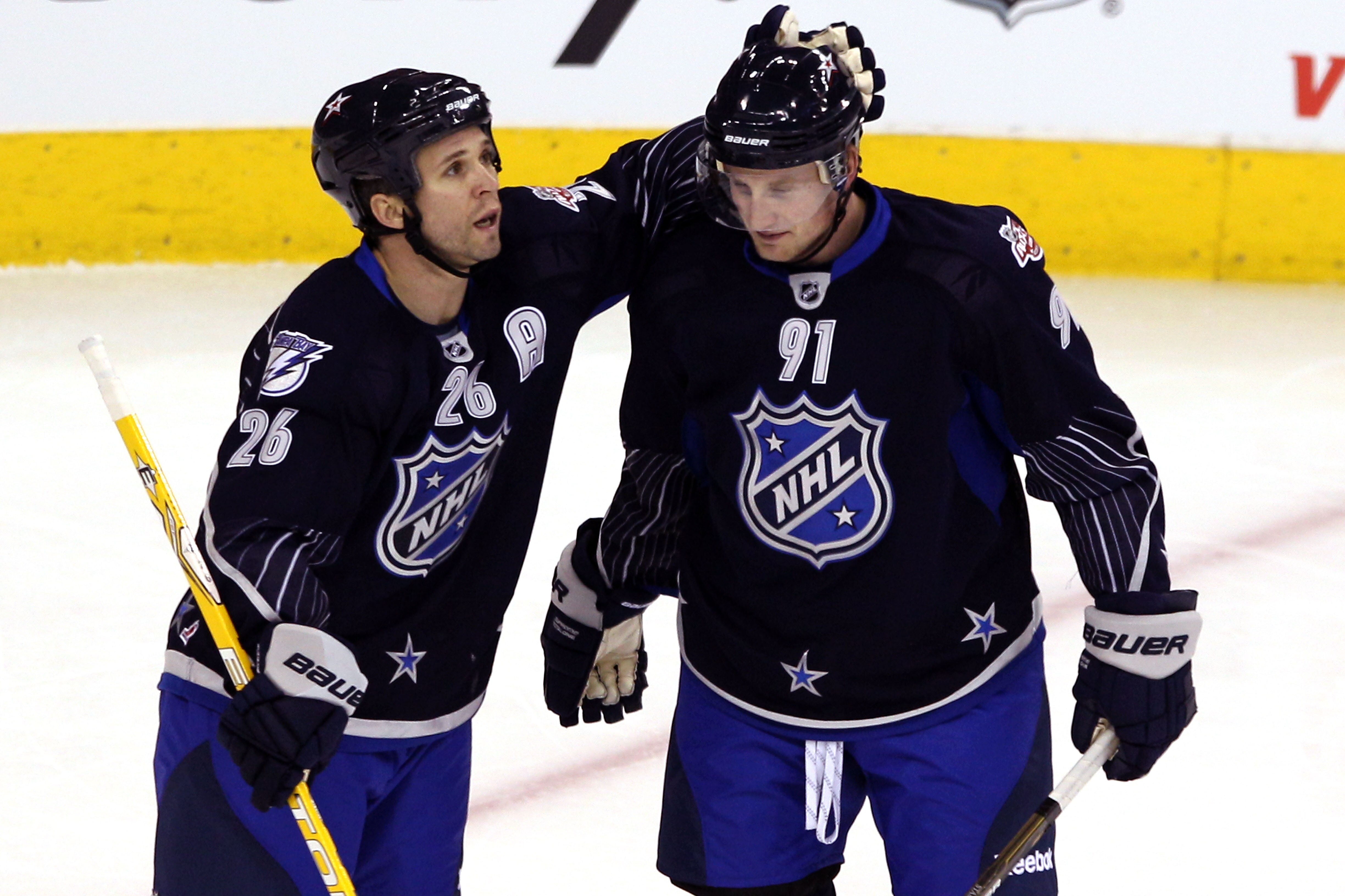RALEIGH, NC - JANUARY 30:  Team Lidstrom players Steven Stamkos #91 of the Tampa Bay Lightning celebrates with Martin St. Louis #26 of the Tampa Bay Lightning after Stamkos scored a second period goal against Team Staal in the 58th NHL All-Star Game at RB