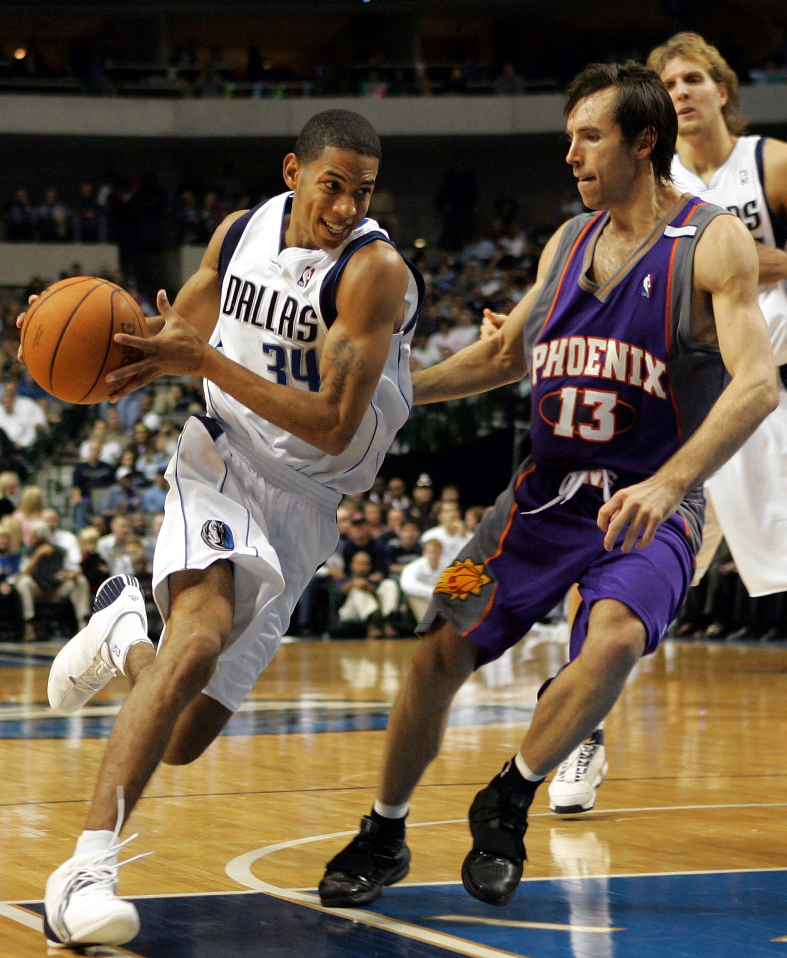 DALLAS - NOVEMBER 16: Devin Harris #34 of the Dallas Mavericks moves the ball past Steve Nash #13 of the Phoenix Suns on November 16, 2004 at the American Airlines Center in Dallas, Texas. NOTE TO USER: User expressly acknowledges and agrees that, by do DALLAS - NOVEMBER 16: Devin Harris #34 of the Dallas Mavericks moves the ball past Steve Nash #13 of the Phoenix Suns on November 16, 2004 at the American Airlines Center in Dallas, Texas. NOTE TO USER: User expressly acknowledges and agrees that, by do