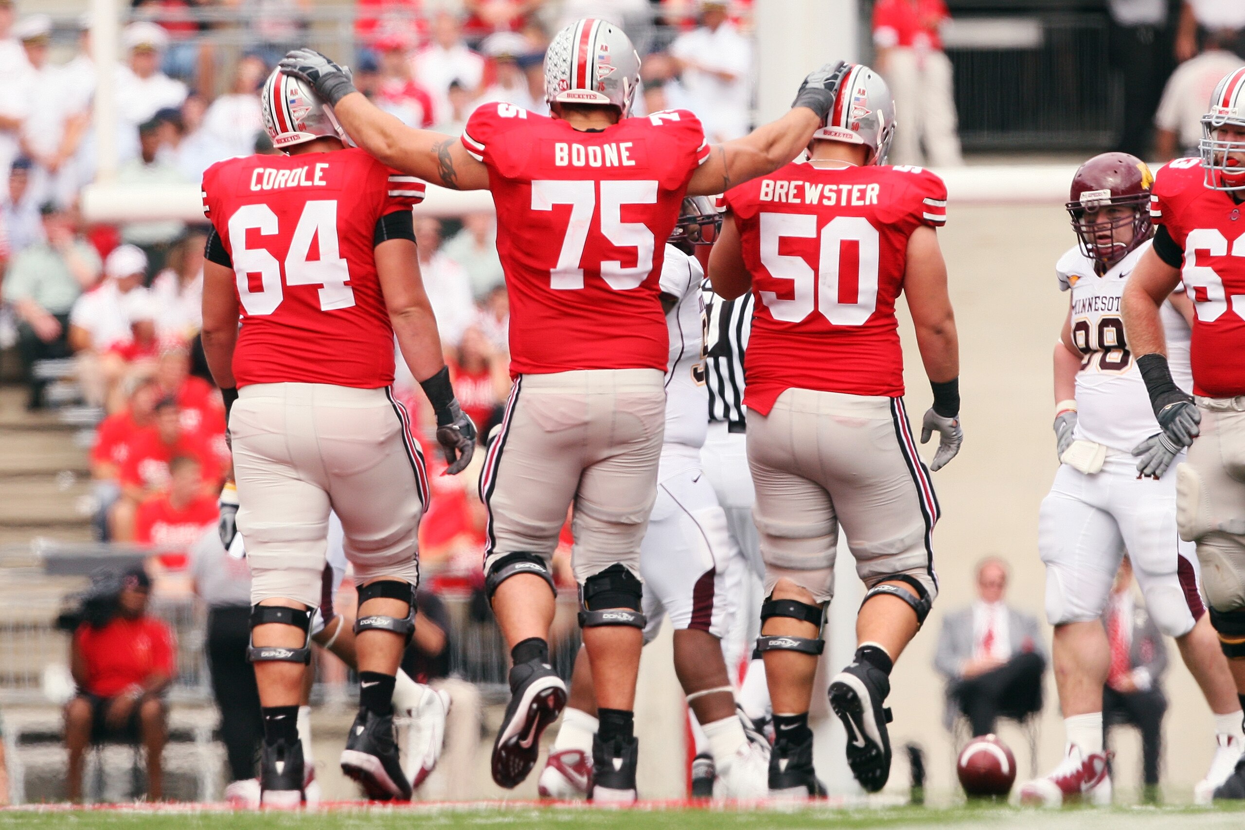 COLUMBUS, OH - SEPTEMBER 27:  Offensive lineman Jim Cordle #64, Alex Boone #75 and Mike Brewster #50 of the Ohio State Buckeyes walk up the line of scrimmage in the second half of a 34-21 victory over the Minnesota Golden Gophers on September 27, 2008 at