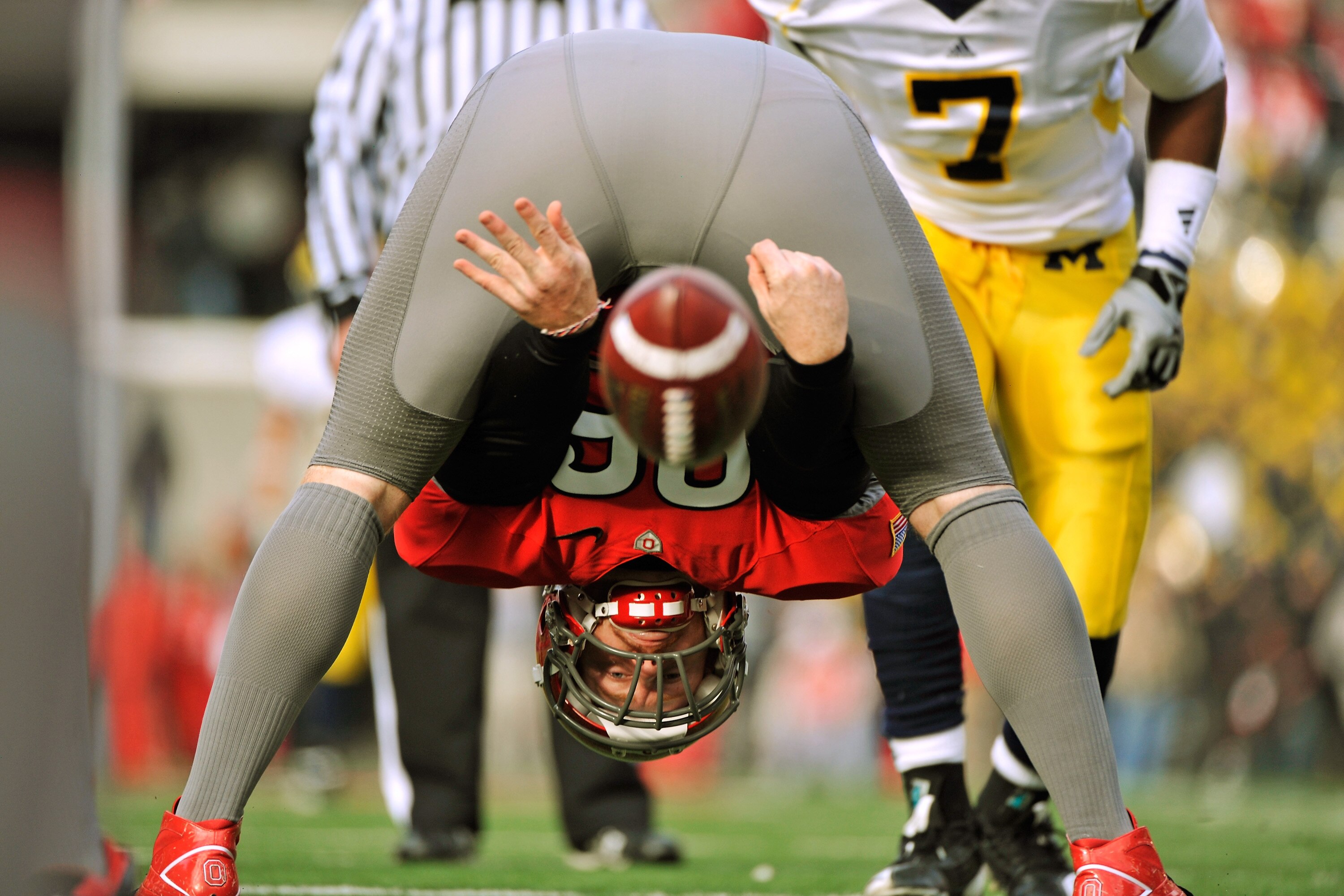 COLUMBUS, OH - NOVEMBER 27:  Long snapper Jake McQuaide #96 of the Ohio State Buckeyes snaps the ball back to the punter during the fourth quarter of a game against the Michigan Wolverines at Ohio Stadium on November 27, 2010 in Columbus, Ohio.  (Photo by