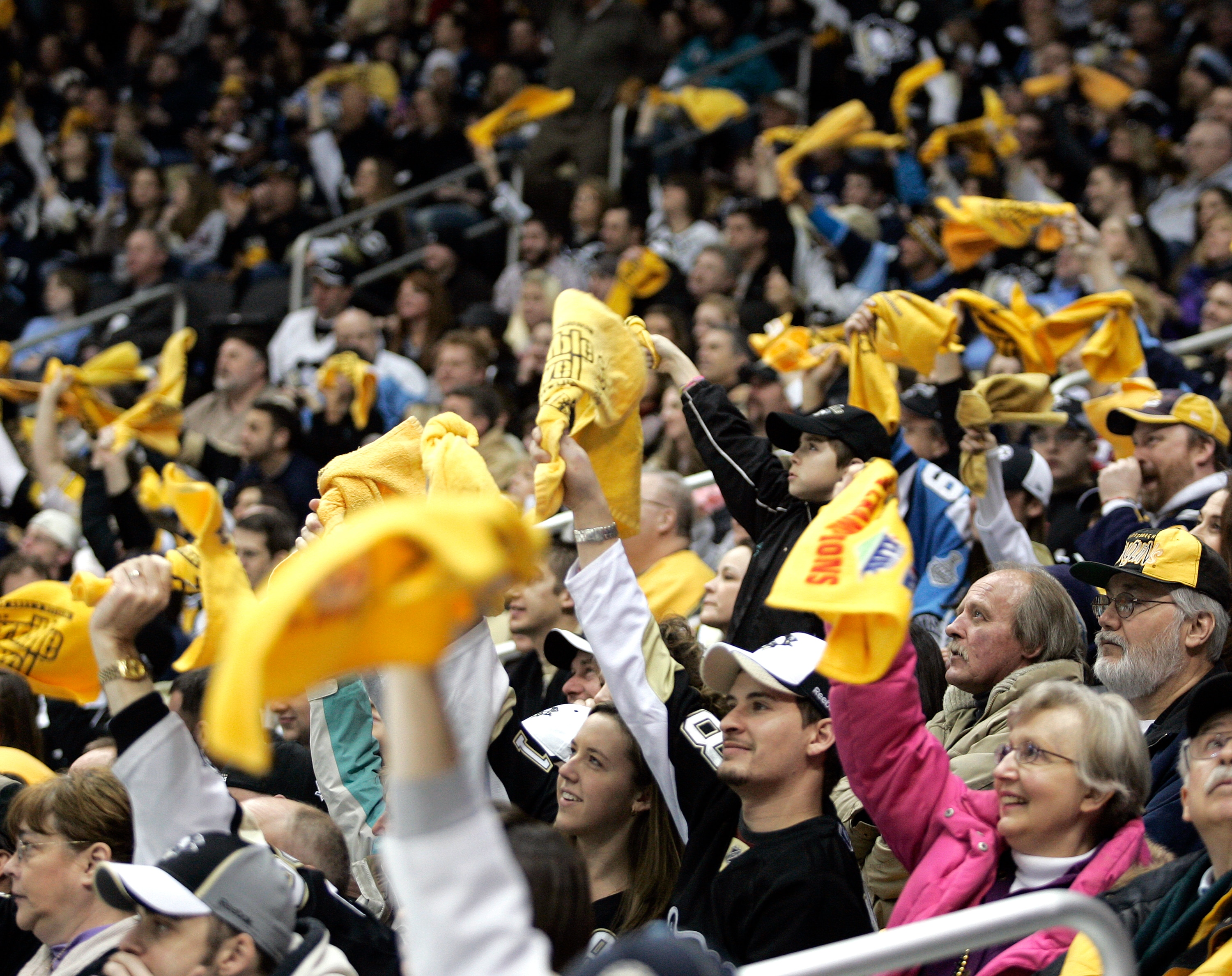 PITTSBURGH, PA - FEBRUARY 04:  Pittsburgh Penguin fans support the Pittsburgh Steelers during the game with terrible towels against the Buffalo Sabres at the Consol Energy Center on February 4, 2011 in Pittsburgh, Pennsylvania.  (Photo by Justin K. Aller/