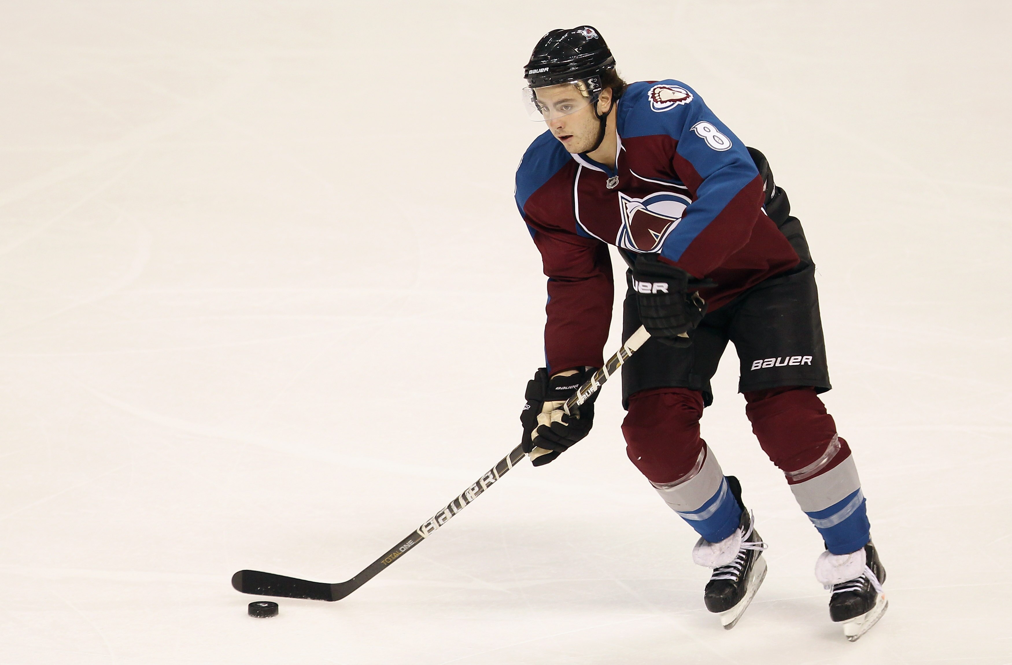 DENVER - DECEMBER 23:  Kevin Shattenkirk #8 of the Colorado Avalanche controls the puck against the Minnesota Wild at the Pepsi Center on December 23, 2010 in Denver, Colorado. The Wild defeated the Avalanche 3-1.  (Photo by Doug Pensinger/Getty Images)