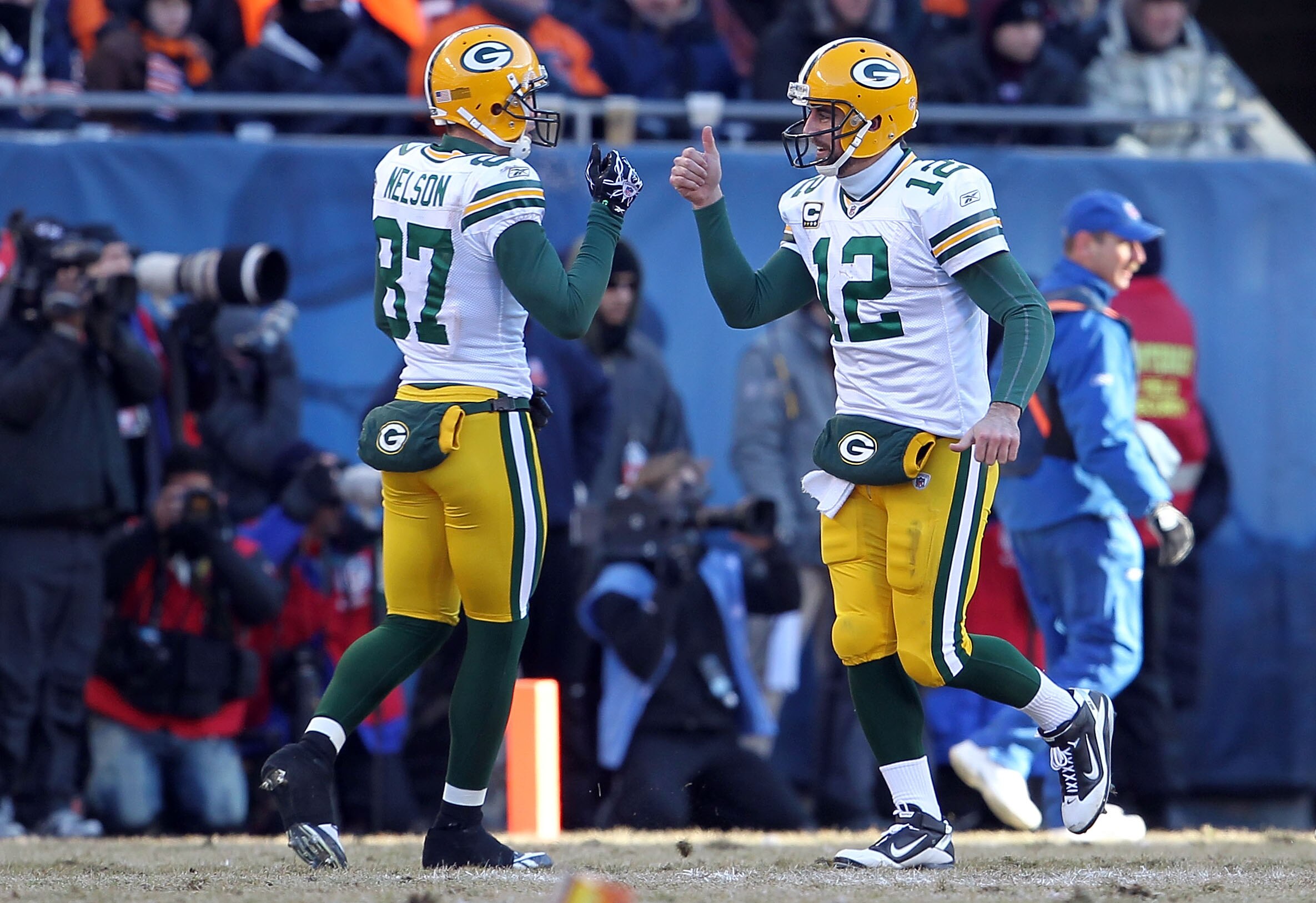 CHICAGO, IL - JANUARY 23:  Wide receiver Jordy Nelson #87 and Aaron Rodgers #12 of the Green Bay Packers react after running back James Starks #44 of the Packers scores on a four-yard touchdown in the second quarter against the Chicago Bears in the NFC Ch