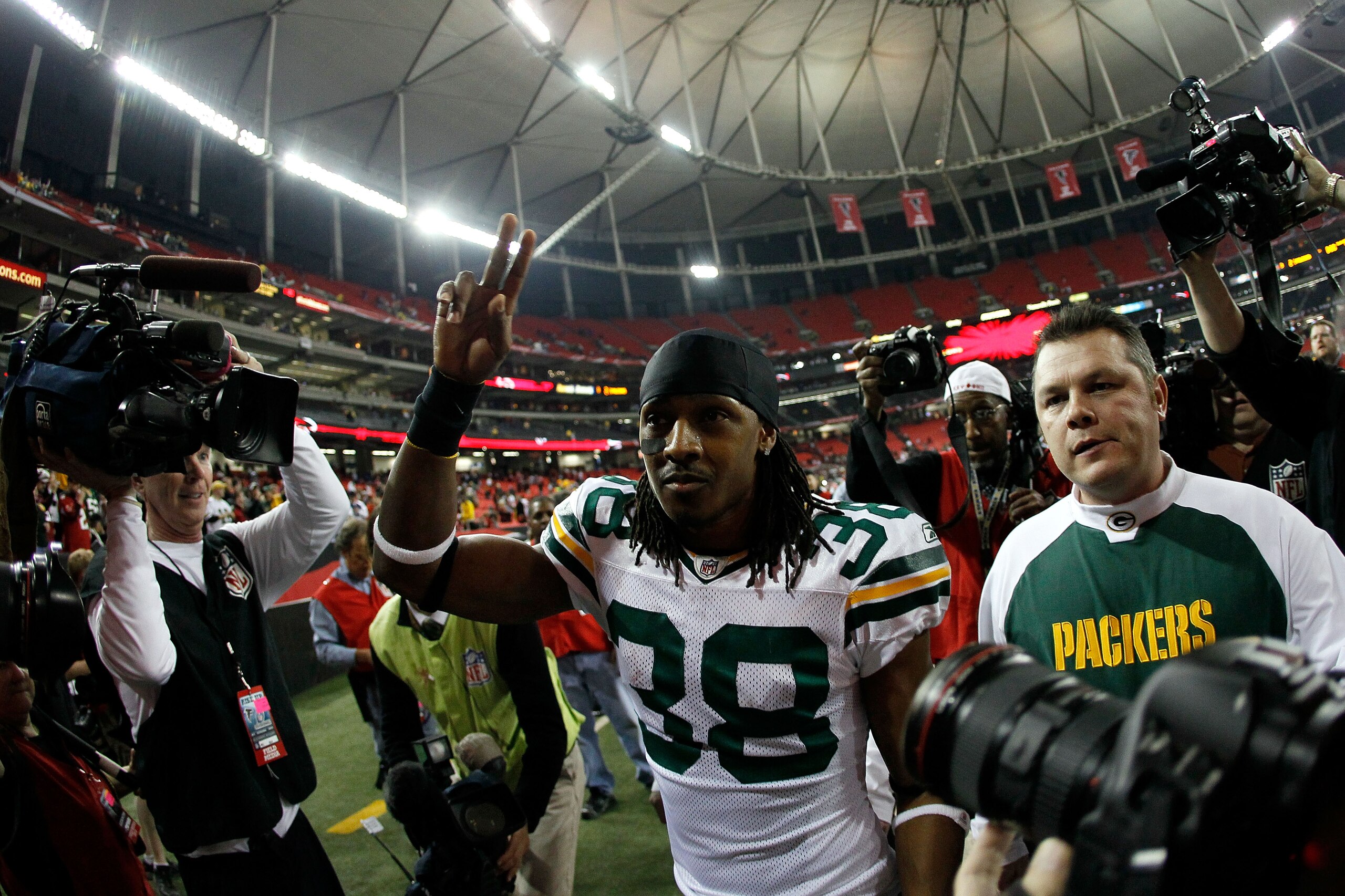 ATLANTA, GA - JANUARY 15:  Tramon Williams #38 of the Green Bay Packers walks off the field after the Packers won 48-21 against the Atlanta Falcons during their 2011 NFC divisional playoff game at Georgia Dome on January 15, 2011 in Atlanta, Georgia.  (Ph