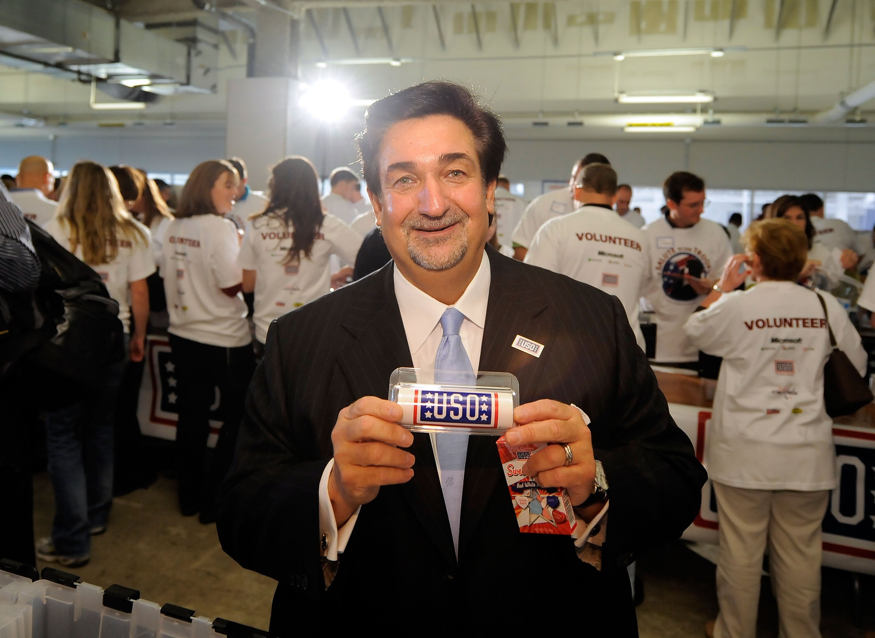 ARLINGTON, VA - NOVEMBER 09:  Ted Leonsis, owner of the Washington Capitols joins volunteers in creating care packages for active duty US Military personal serving in Iraq and Afghanistan during Microsoft's 'A Salute to Our Troops' Operation USO Care Pack