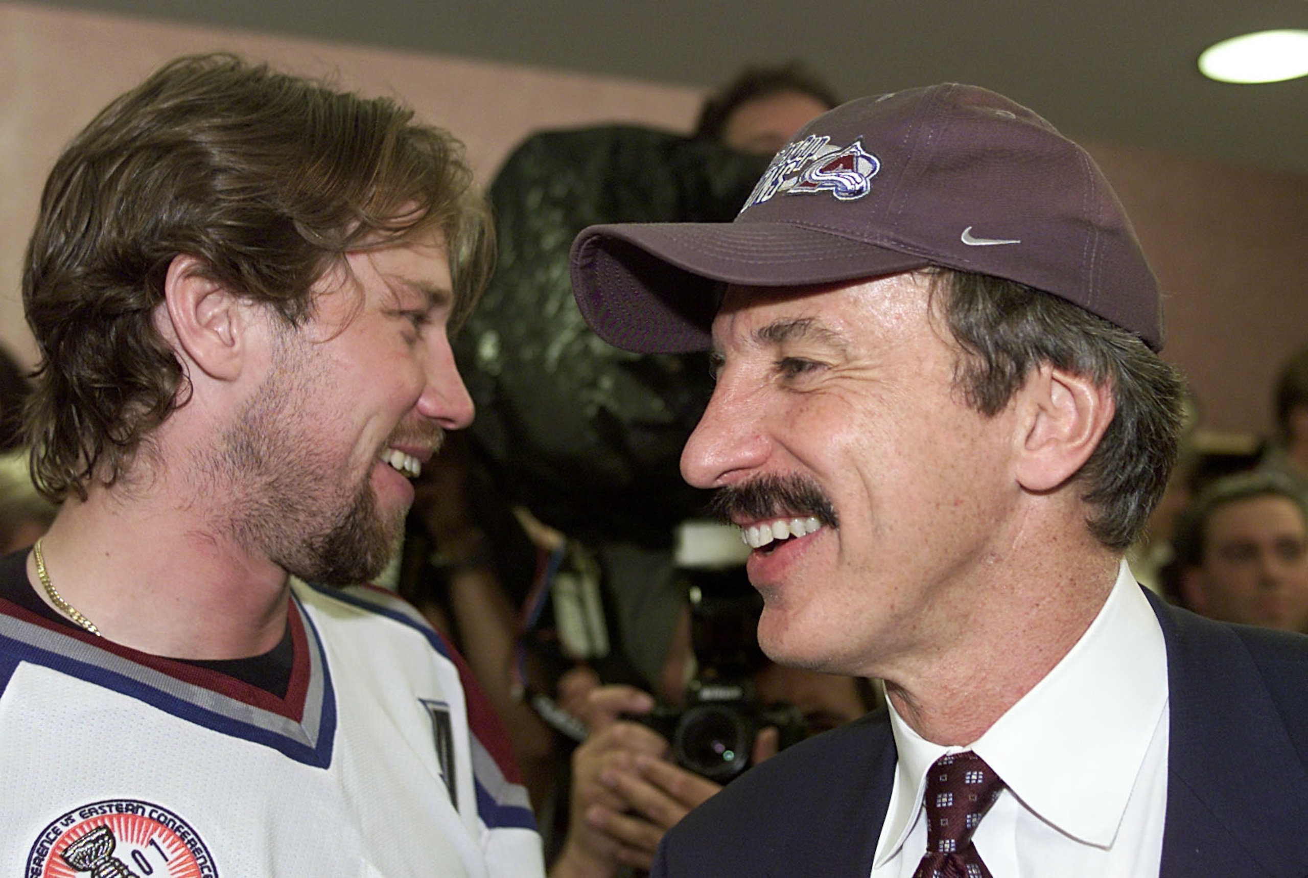 9 Jun 2001:  Peter Forsberg #21 of the Colorado Avalanche shares a laugh with owner Stan Kroenke after Game 7 of the Stanley Cup finals at the Pepsi Center in Denver, Colorado. The Avalanche won 3-1 to take the Stanley Cup from the New Jersey Devils.  DIG