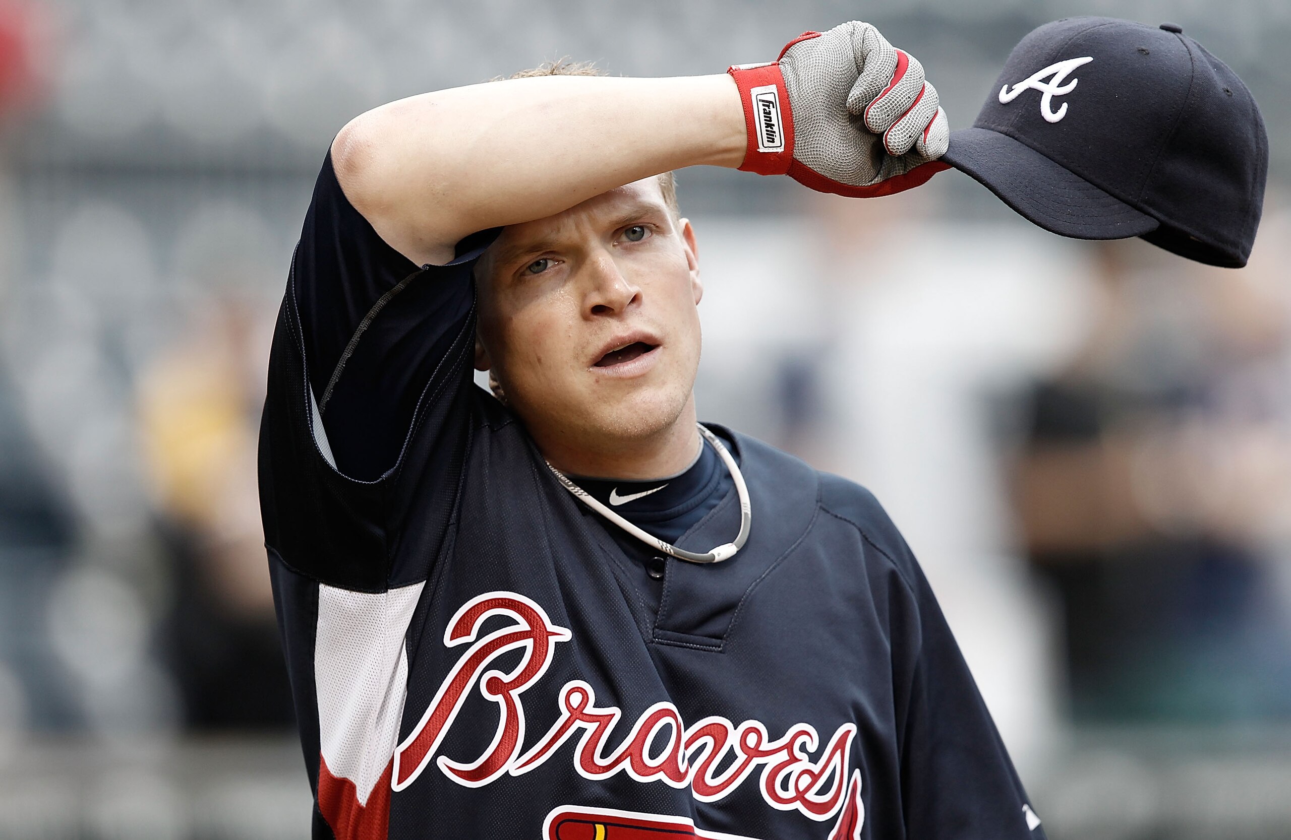 PITTSBURGH - MAY 21:  Nate McLouth #24 of the Atlanta Braves wipes sweat off of his head during batting practice before the game against the Pittsburgh Pirates on May 21, 2010 at PNC Park in Pittsburgh, Pennsylvania.  (Photo by Jared Wickerham/Getty Image