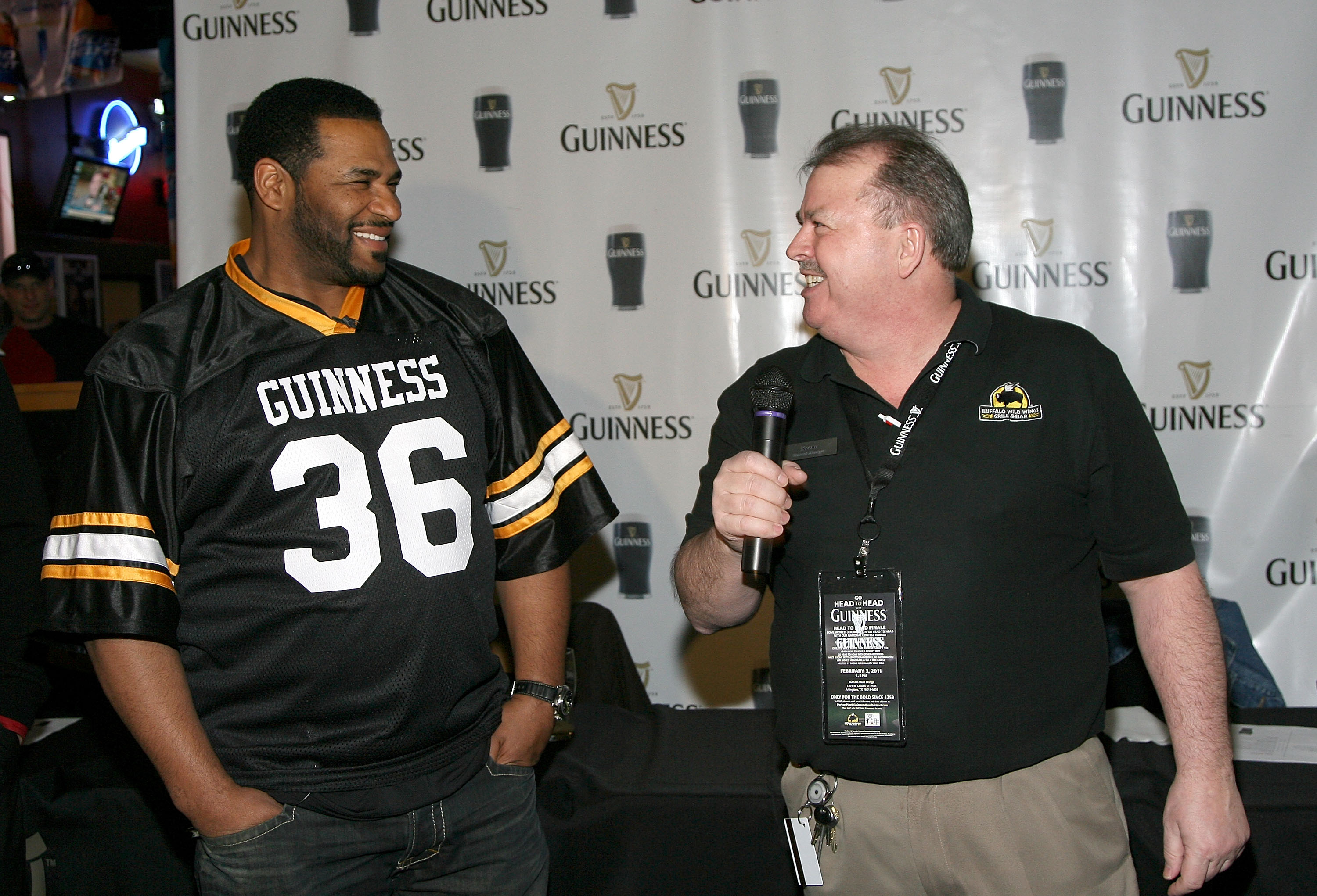 ARLINGTON, TX - FEBRUARY 03:  Former NFL player Jerome Bettis (Left) competes in the Guinness Perfect Pint Pour-Off at Buffalo Wild Wings on February 3, 2011 in Arlington, Texas.  (Photo by Maury Phillips/Getty Images for Guinness)