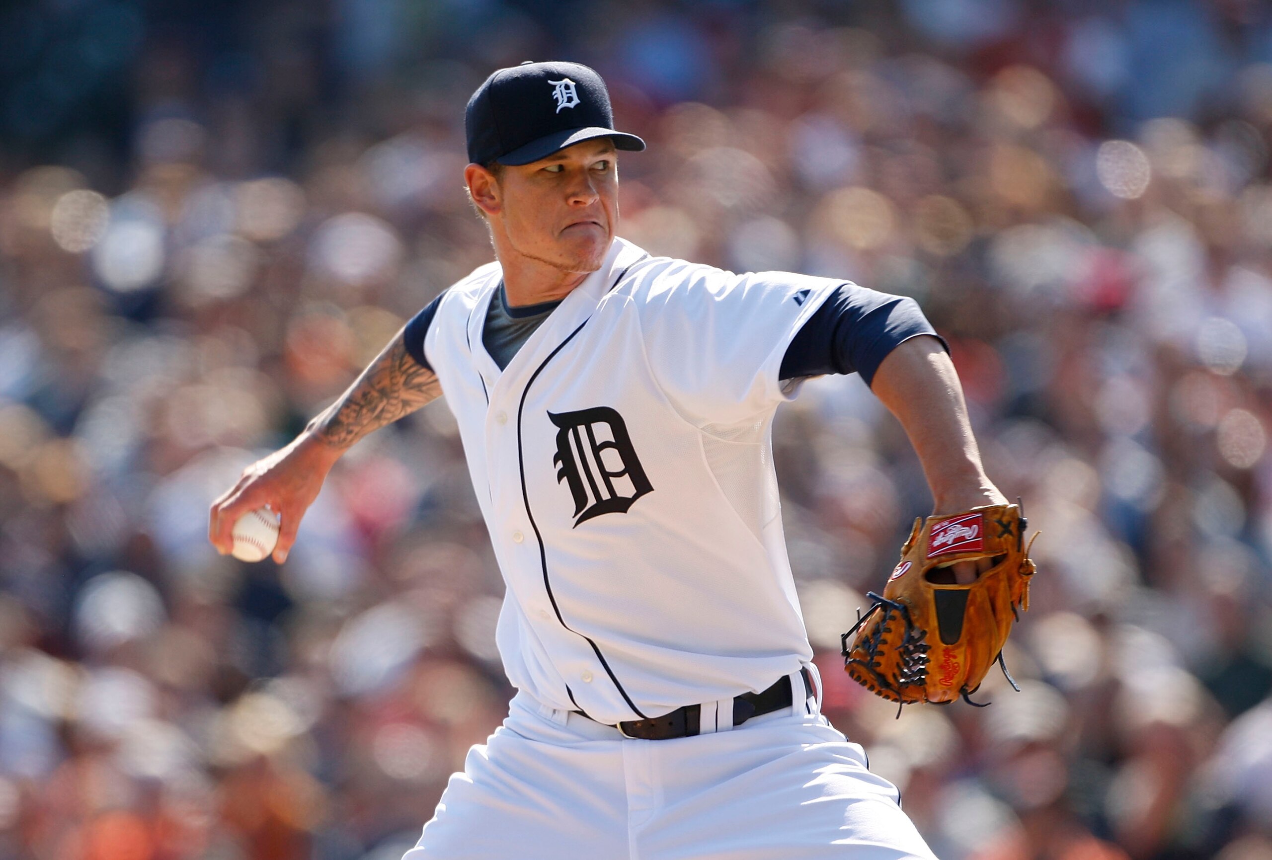 DETROIT - APRIL 10:  Pitcher Ryan Perry #45 of the Detroit Tigers pitches in the ninth inning to close out a win over the Cleveland Indians 4-2 on April 10, 2010 at Comerica Park in Detroit, Michigan.  (Photo by Leon Halip/Getty Images)