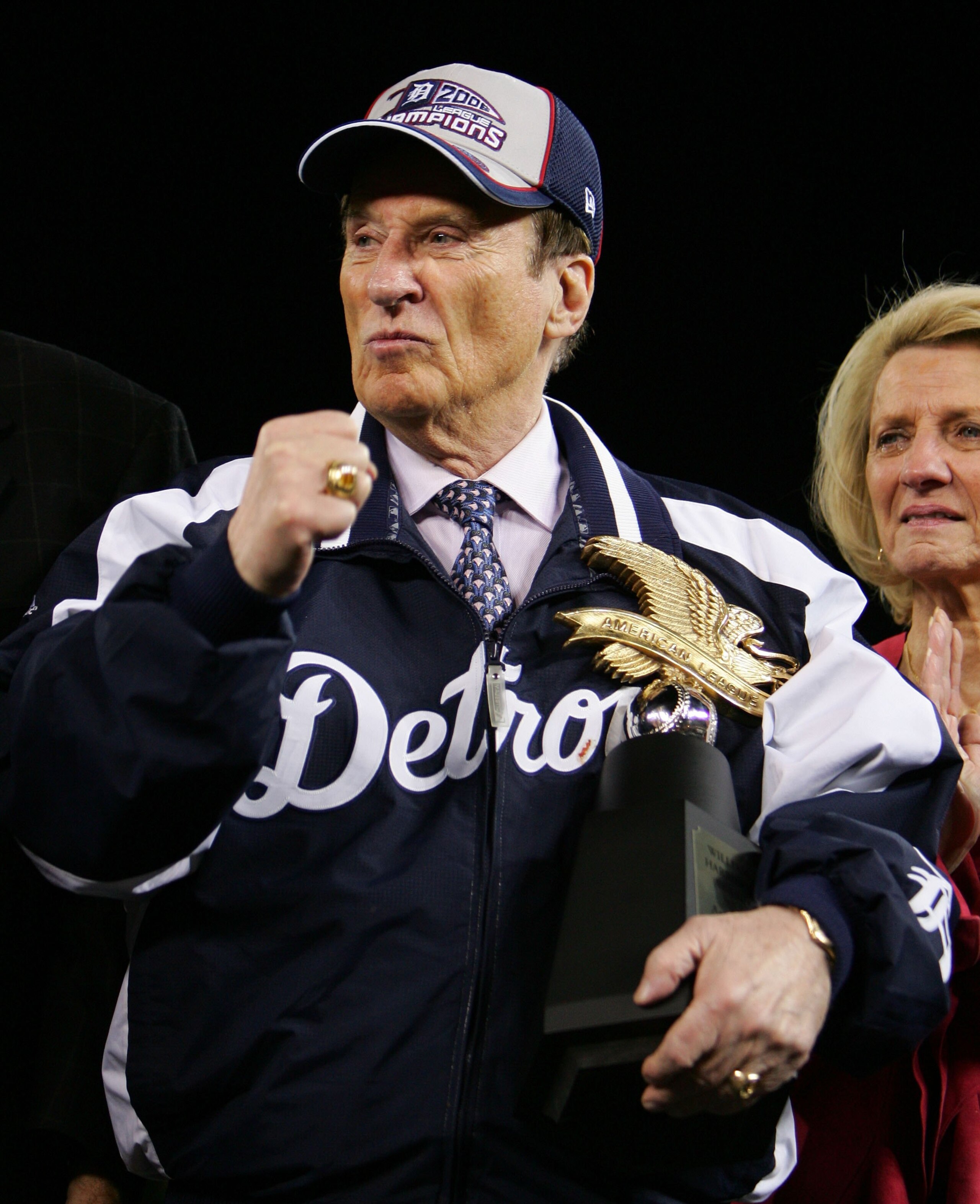 DETROIT - OCTOBER 14:  Owner Michael Ilitch of the Detroit Tigers celebrates on the field with the trophy after defeating the Oakland Athletics in Game Four of the American League Championship Series on October 14, 2006 at Comerica Park in Detroit, Michig