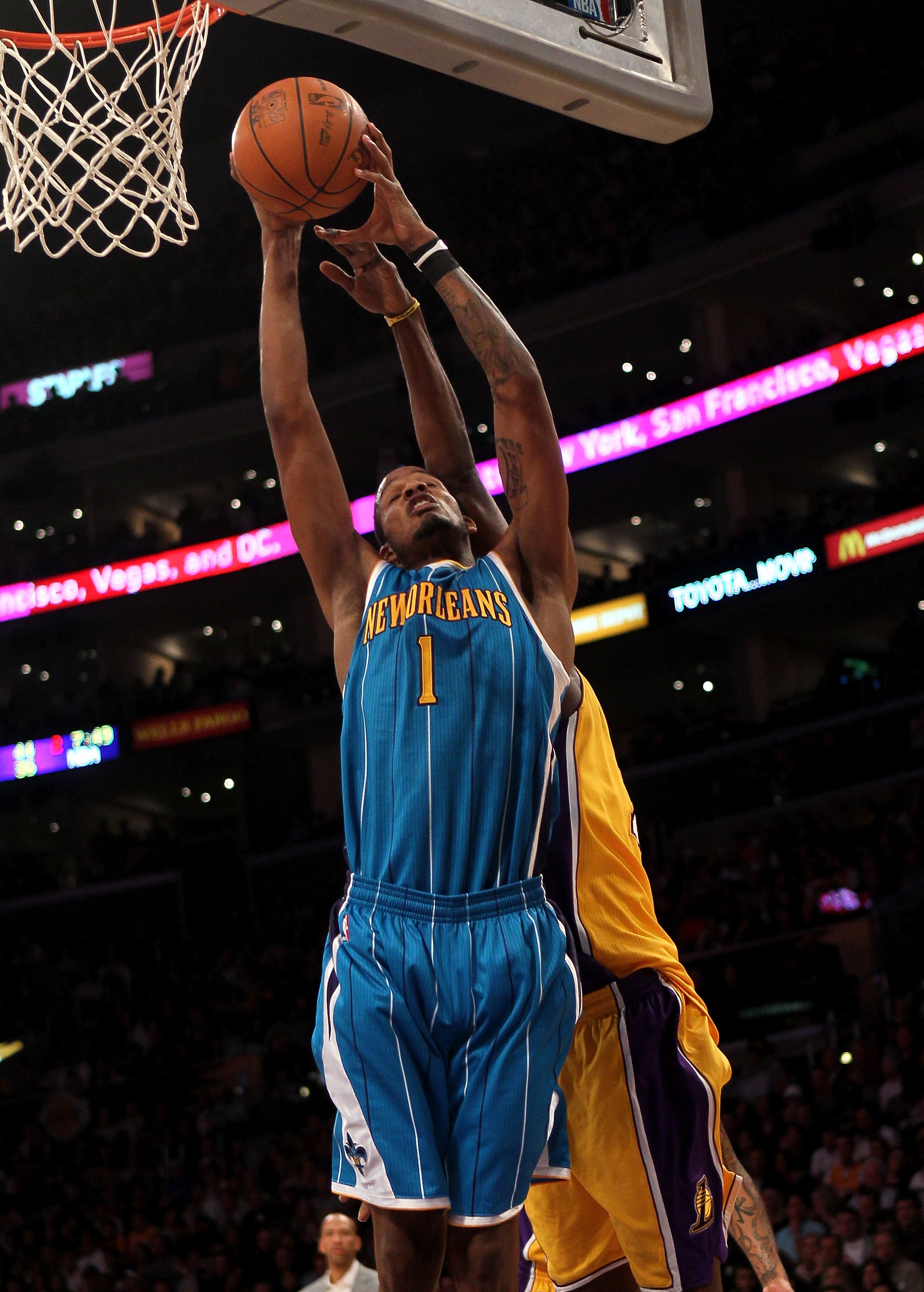 LOS ANGELES, CA - JANUARY 07:  Trevor Ariza #1 of the New Orleans Hornets grabs a rebound against the Los Angeles Lakers at Staples Center on January 7, 2011 in Los Angeles, California.  The Lakers won 101-97.  NOTE TO USER: User expressly acknowledges an