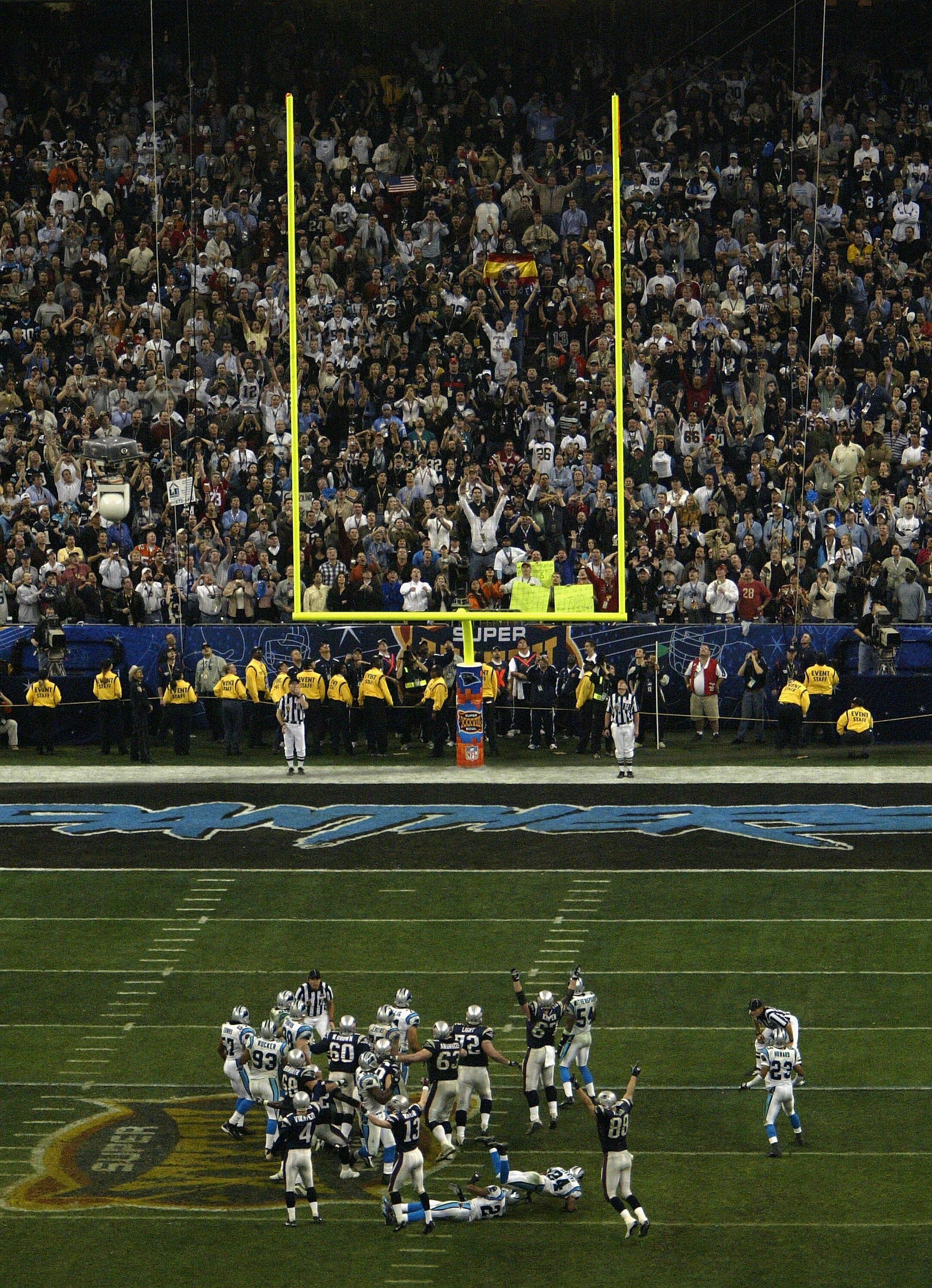 HOUSTON, TX - FEBRUARY 1: Place kicker Adam Vinatieri #4 of the New England Patriots kicks the game winning field goal in the fourth quarter against the Carolina Panthers during Super Bowl XXXVIII at Reliant Stadium on February 1, 2004 in Houston, Texas.