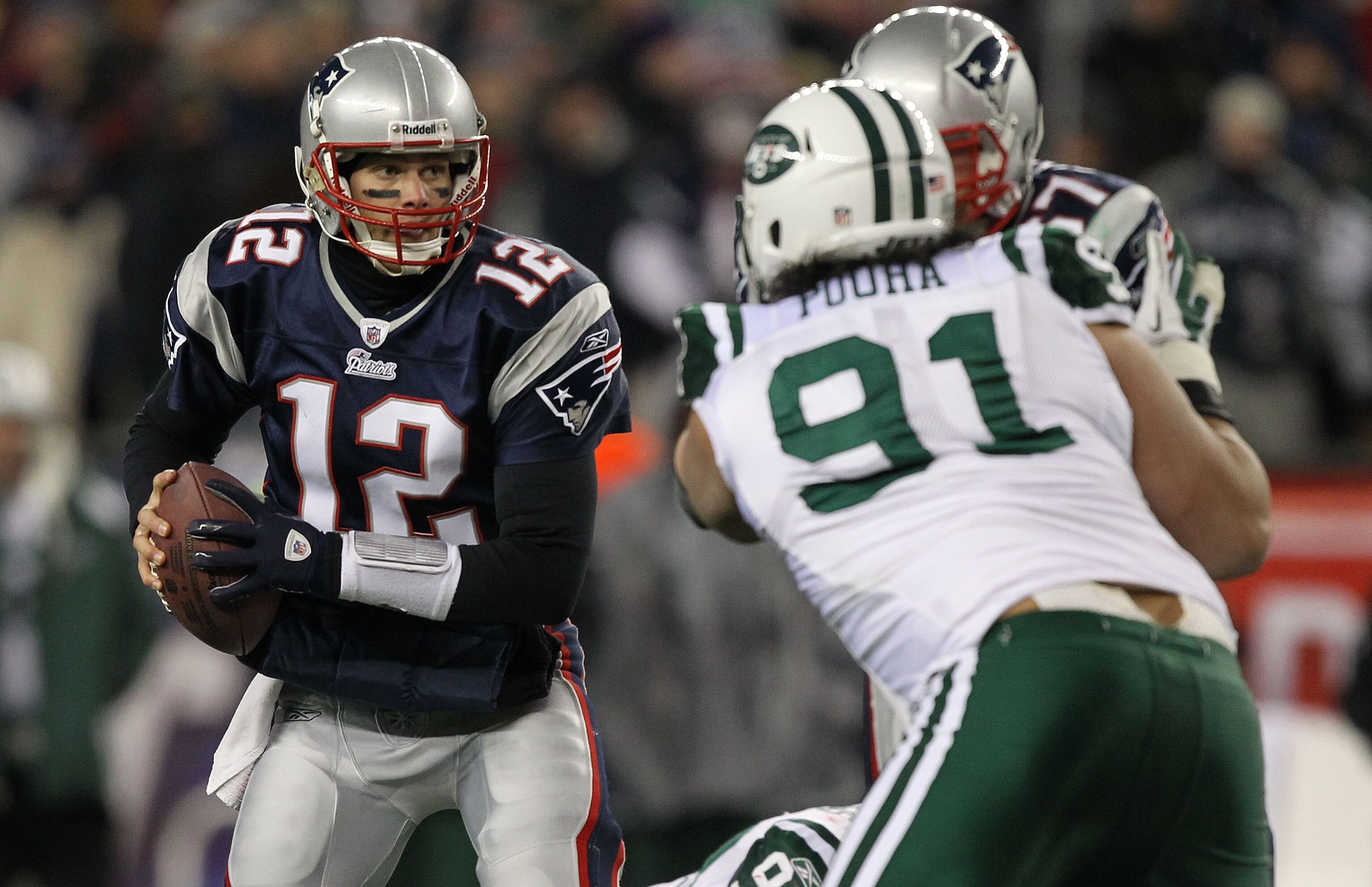 FOXBORO, MA - JANUARY 16:  Quarterback Tom Brady #12 of the New England Patriots looks to pass during their 2011 AFC divisional playoff game against the New York Jets at Gillette Stadium on January 16, 2011 in Foxboro, Massachusetts.  (Photo by Al Bello/G