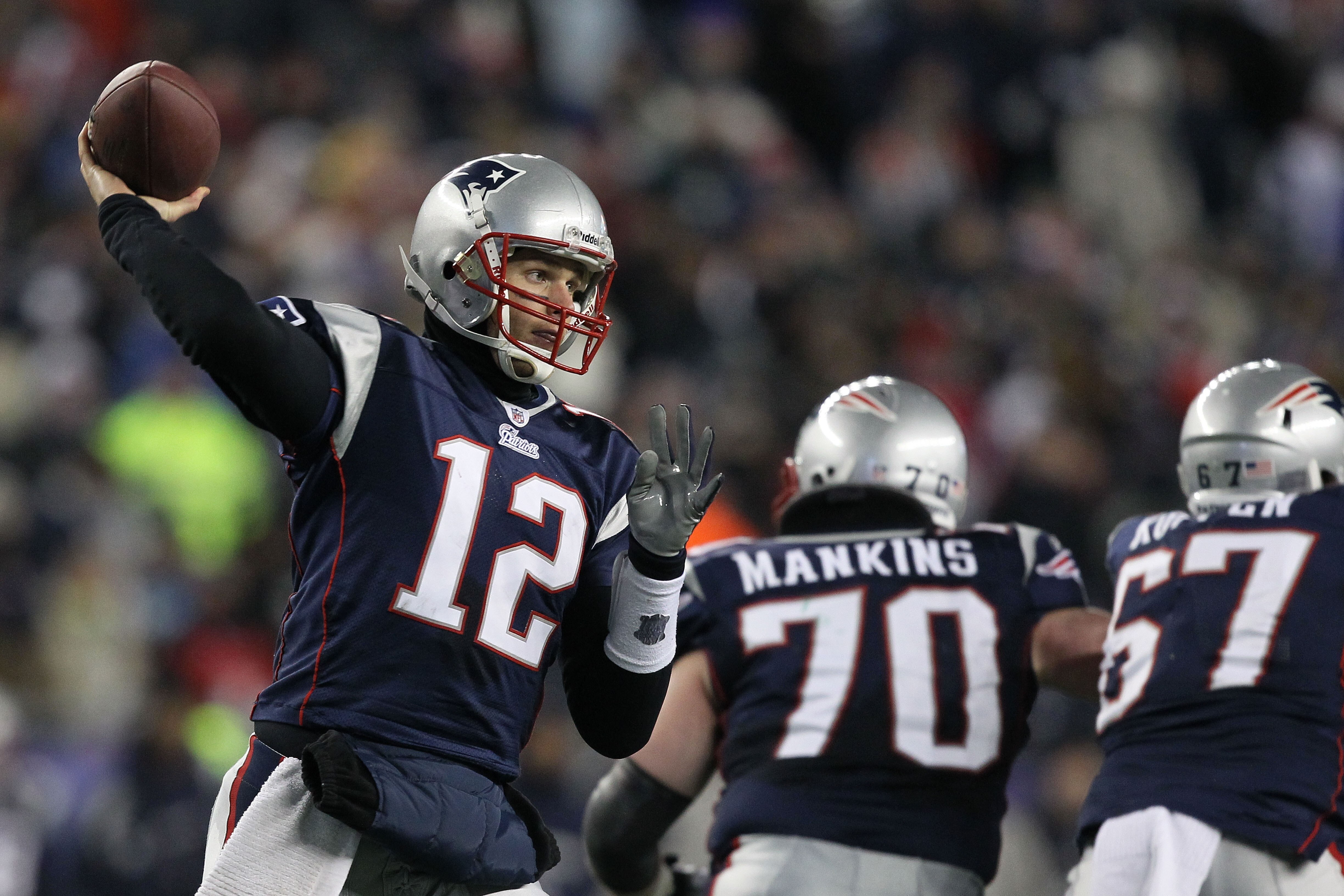 FOXBORO, MA - JANUARY 16:  Quarterback Tom Brady #12 of the New England Patriots throws a pass during their 2011 AFC divisional playoff game against the New York Jets at Gillette Stadium on January 16, 2011 in Foxboro, Massachusetts.  (Photo by Al Bello/G