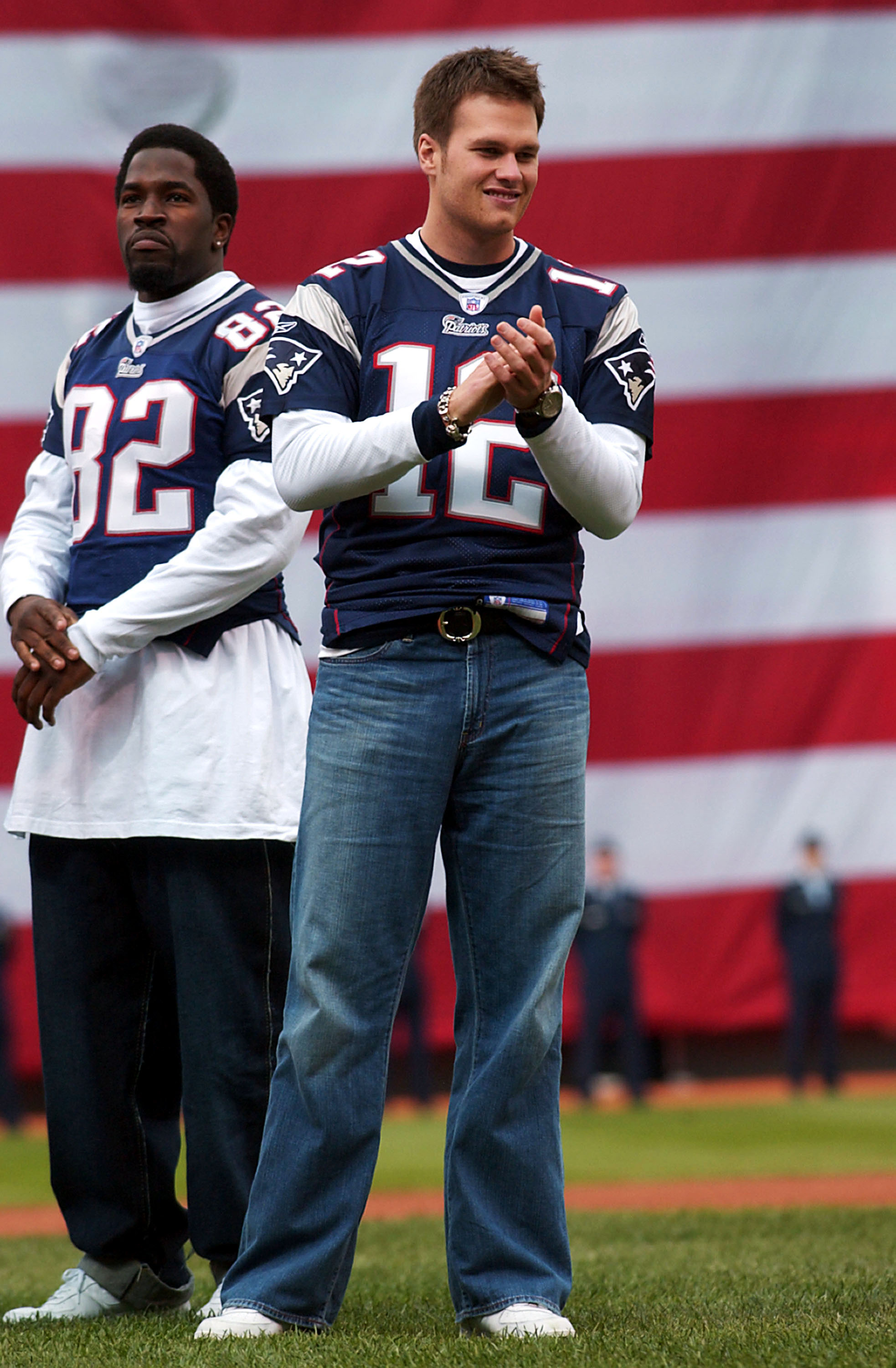 BOSTON - APRIL 9:  Super Bowl Champion New England Patriots MVP Tom Brady #12 and tight end Daniel Graham #82 take the field at opening day of the Boston Red Sox game against the Toronto Blue Jays April 9, 2004 at Fenway Park in Boston, Massachusetts.  (P