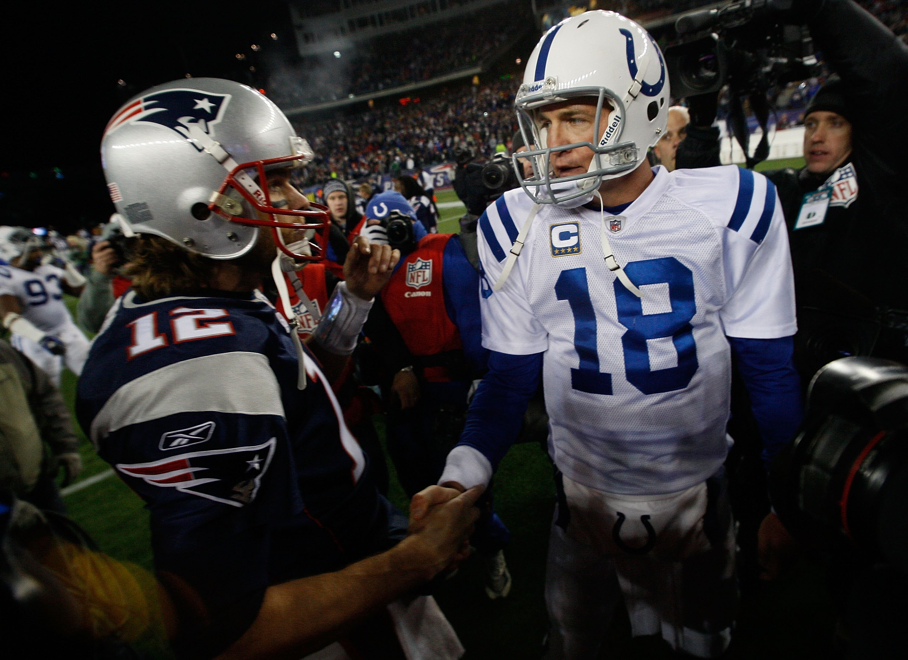 FOXBORO, MA - NOVEMBER 21:  Tom Brady #12 of the New England Patriots shakes hands with Peyton Manning #18 of the Indianapolis Colts after their game at Gillette Stadium on November 21, 2010 in Foxboro, Massachusetts. (Photo by Jim Rogash/Getty Images)