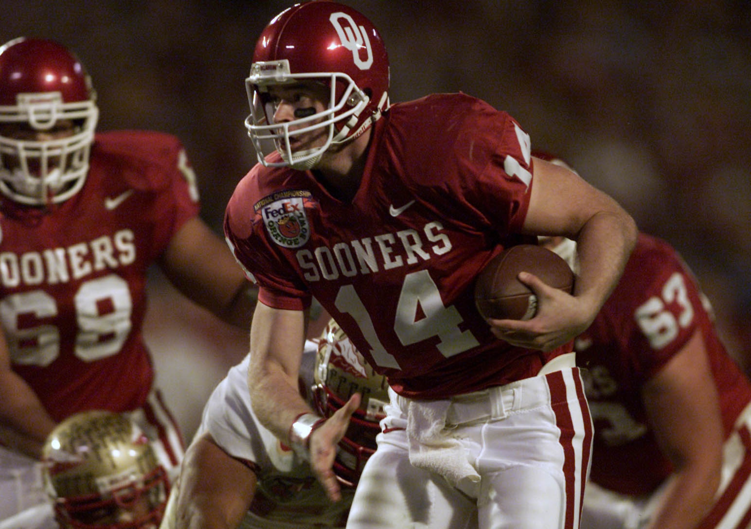 3 Jan 2001:  Quarterback Josh Heupel #14 of the Oklahoma Sooners is chased out of the pocket by the Florida State Seminoles during the Orange Bowl at Pro Player Stadium in Miami, Florida. DIGITAL IMAGE Mandatory Credit: Andy Lyons/ALLSPORT