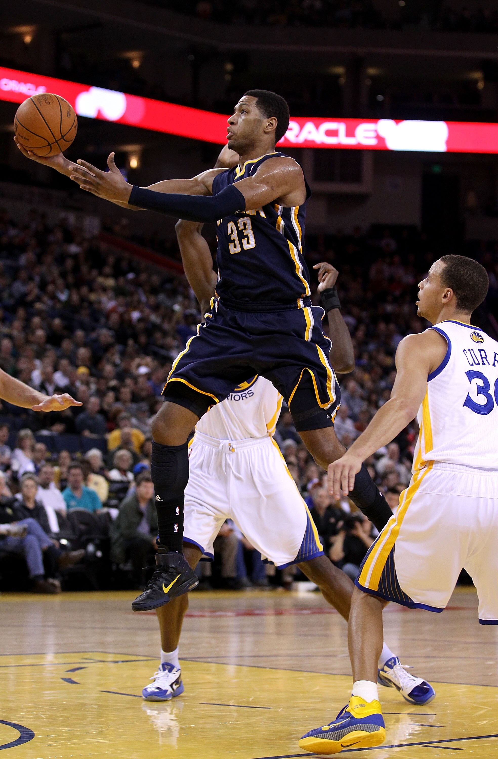 OAKLAND, CA - JANUARY 19:  Danny Granger #33 of the Indiana Pacers goes up for a shot against the Golden State Warriors at Oracle Arena on January 19, 2011 in Oakland, California.  NOTE TO USER: User expressly acknowledges and agrees that, by downloading