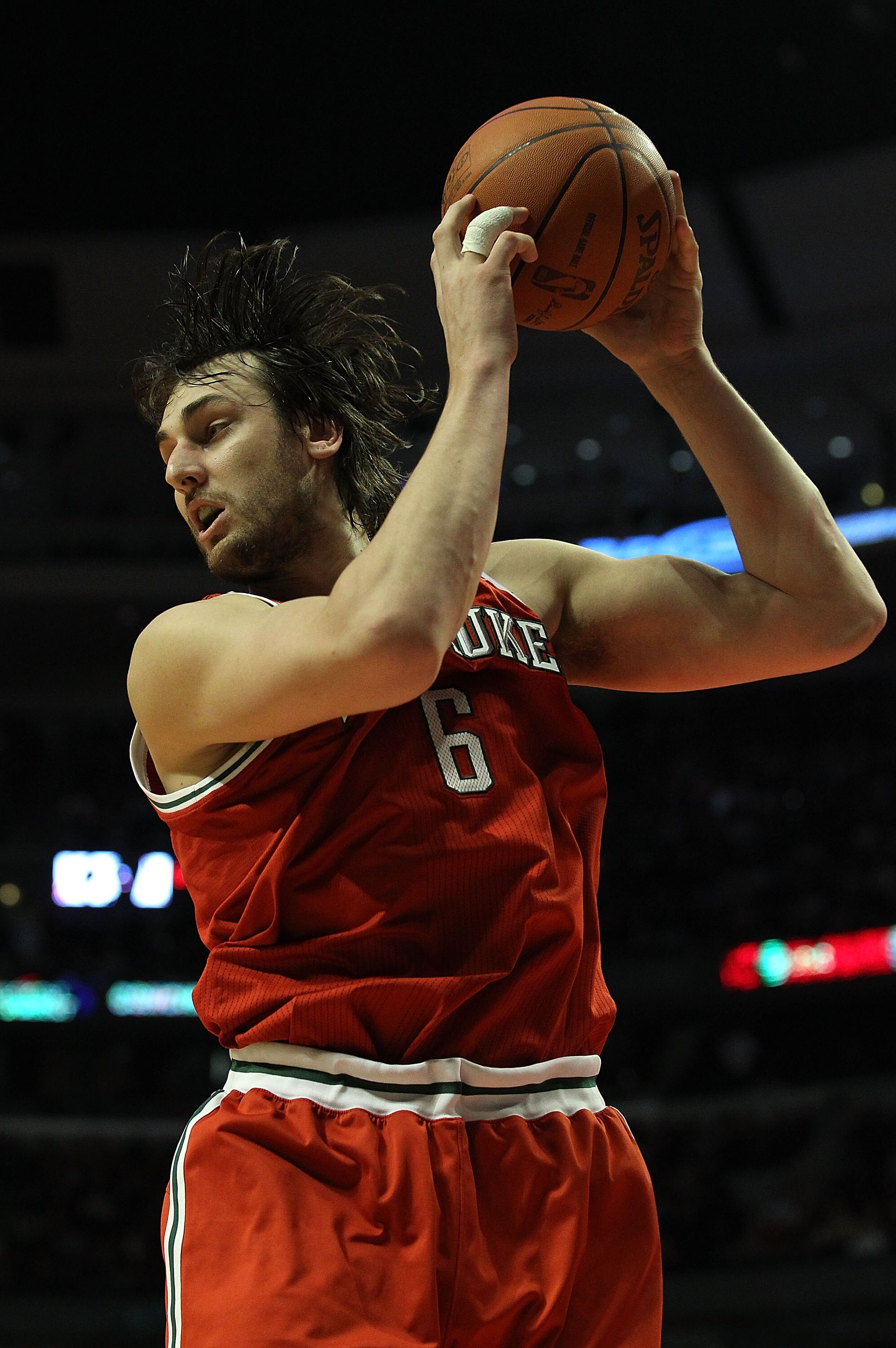 CHICAGO, IL - DECEMBER 28: Andrew Bogut #6 of the Milwaukee Bucks pulls down a rebound against the Chicago Bulls at the United Center on December 28, 2010 in Chicago, Illinois. The Bulls defeated the Bucks 90-77. NOTE TO USER: User expressly acknowledges