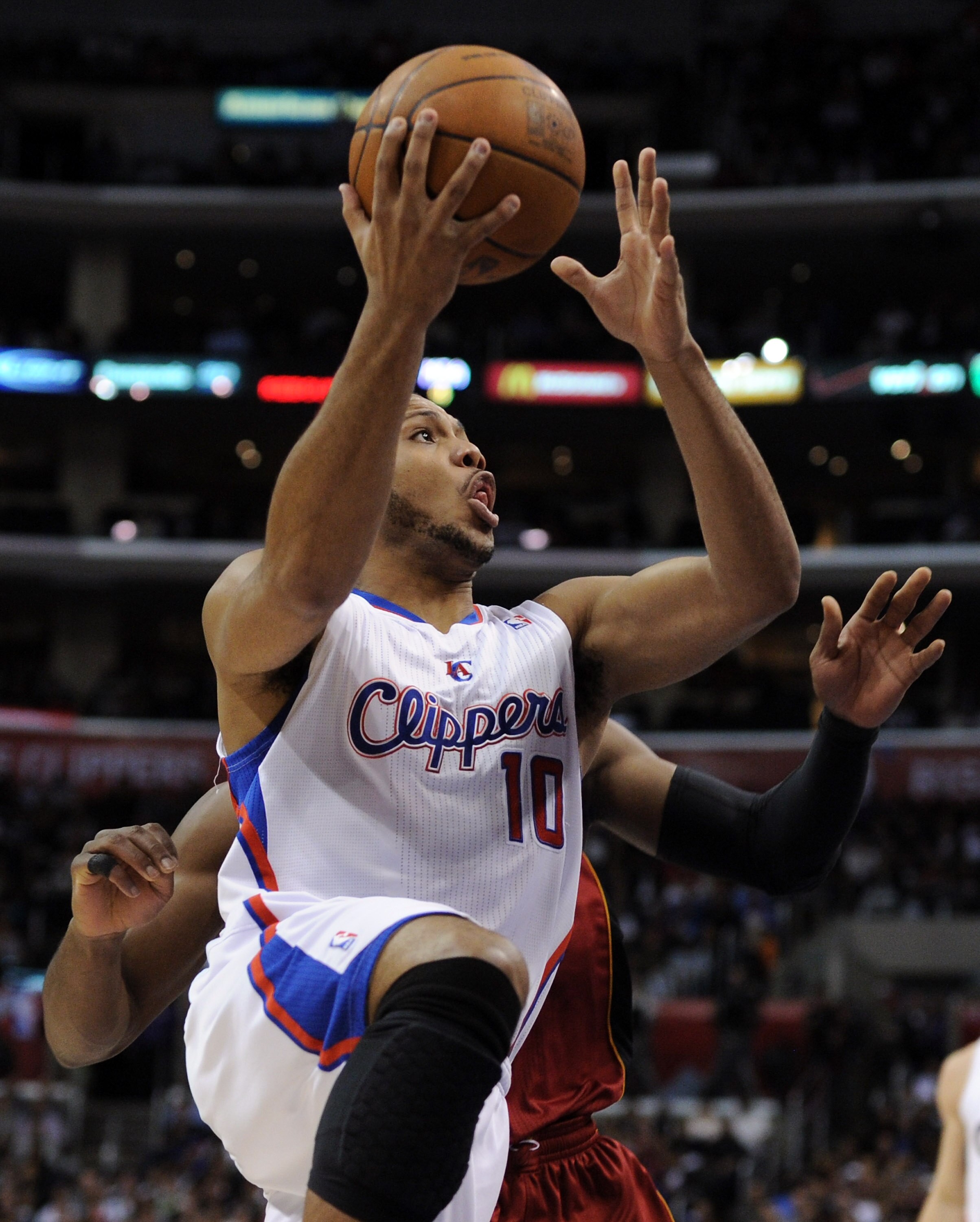 LOS ANGELES, CA - JANUARY 12:  Eric Gordon #10 of the Los Angeles Clippers scores on a layup against the Miami Heat at Staples Center on January 12, 2011 in Los Angeles, California.  NOTE TO USER: User expressly acknowledges and agrees that, by downloadin