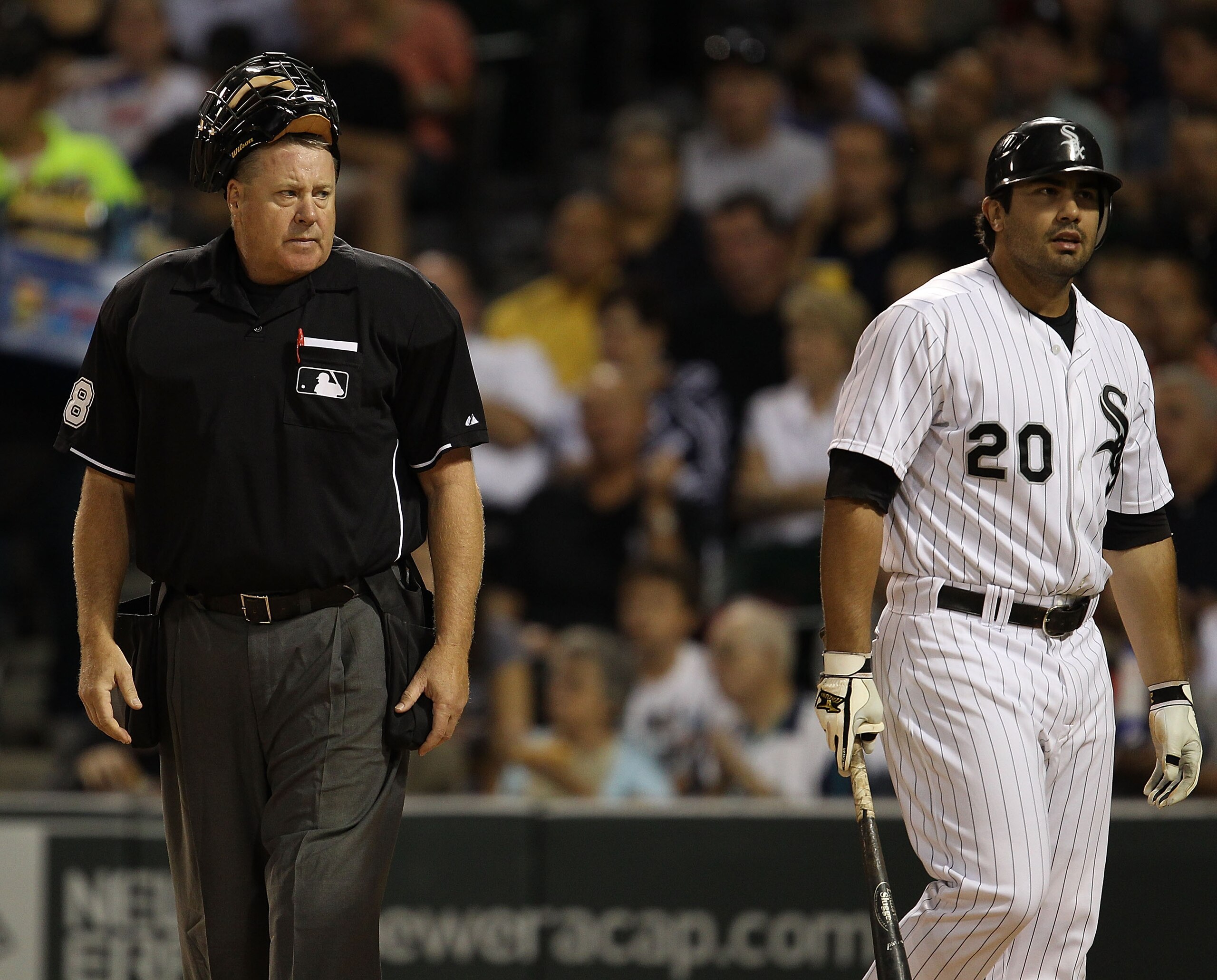 CHICAGO - AUGUST 25: Home plate umpire Gary Cederstrom #38 glares at Carlos Quentin #20 of the Chicago White Sox after an exchange of words on a called third strike during a game against the Baltimore Orioles at U.S. Cellular Field on August 25, 2010 in C
