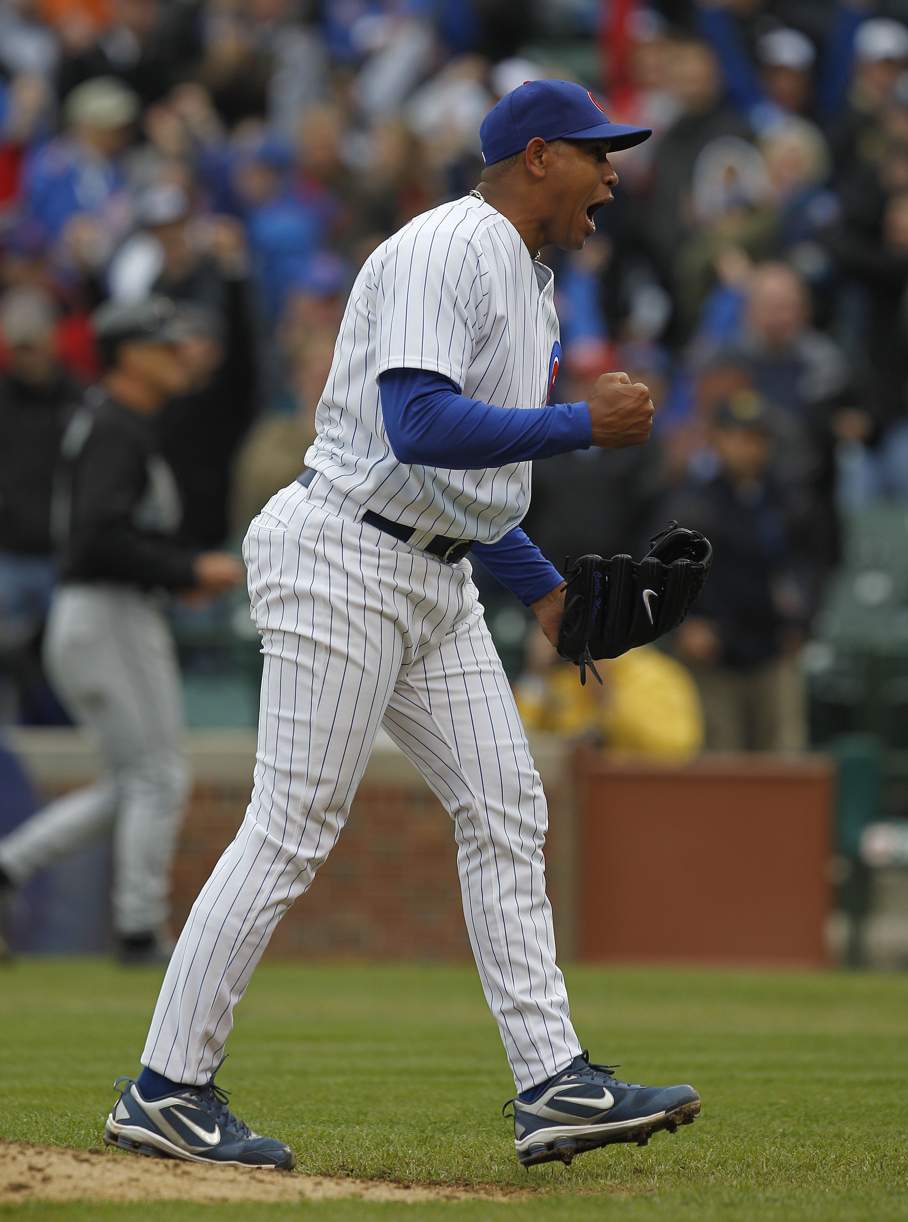 CHICAGO - MAY 12: Carlos Marmol #49 of the Chicago Cubs celebrates a win over the Florida Marlins at Wrigley Field on May 12, 2010 in Chicago, Illinois. The Cubs defeated the Marlins 4-3. (Photo by Jonathan Daniel/Getty Images)