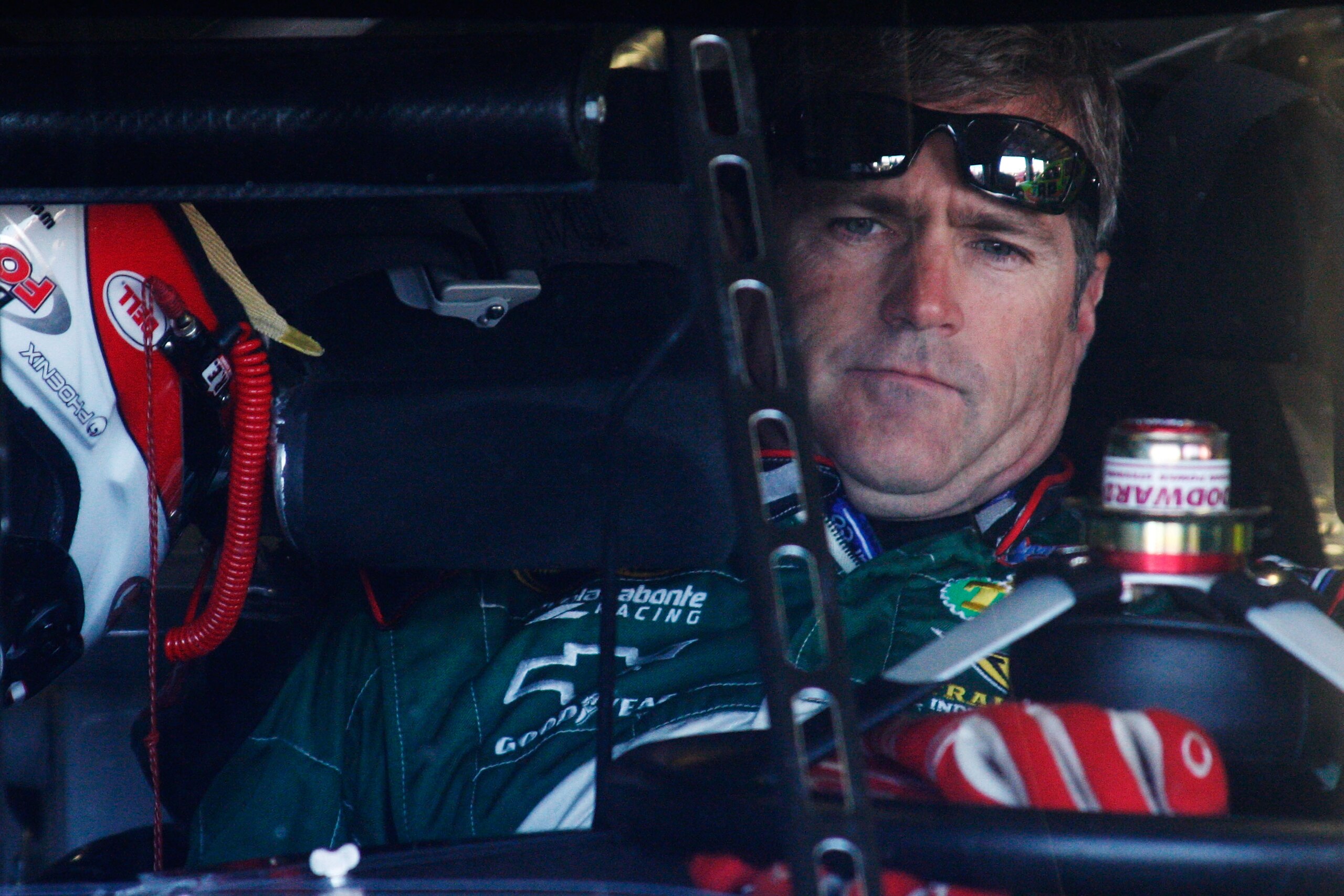 FORT WORTH, TX - NOVEMBER 06:  Bobby Labonte, driver of the #10 Gander Mountain Outdoors Chevrolet, sits in his car in the garage area during practice for the NASCAR Sprint Cup Series AAA Texas 500 at Texas Motor Speedway on November 6, 2010 in Fort Worth
