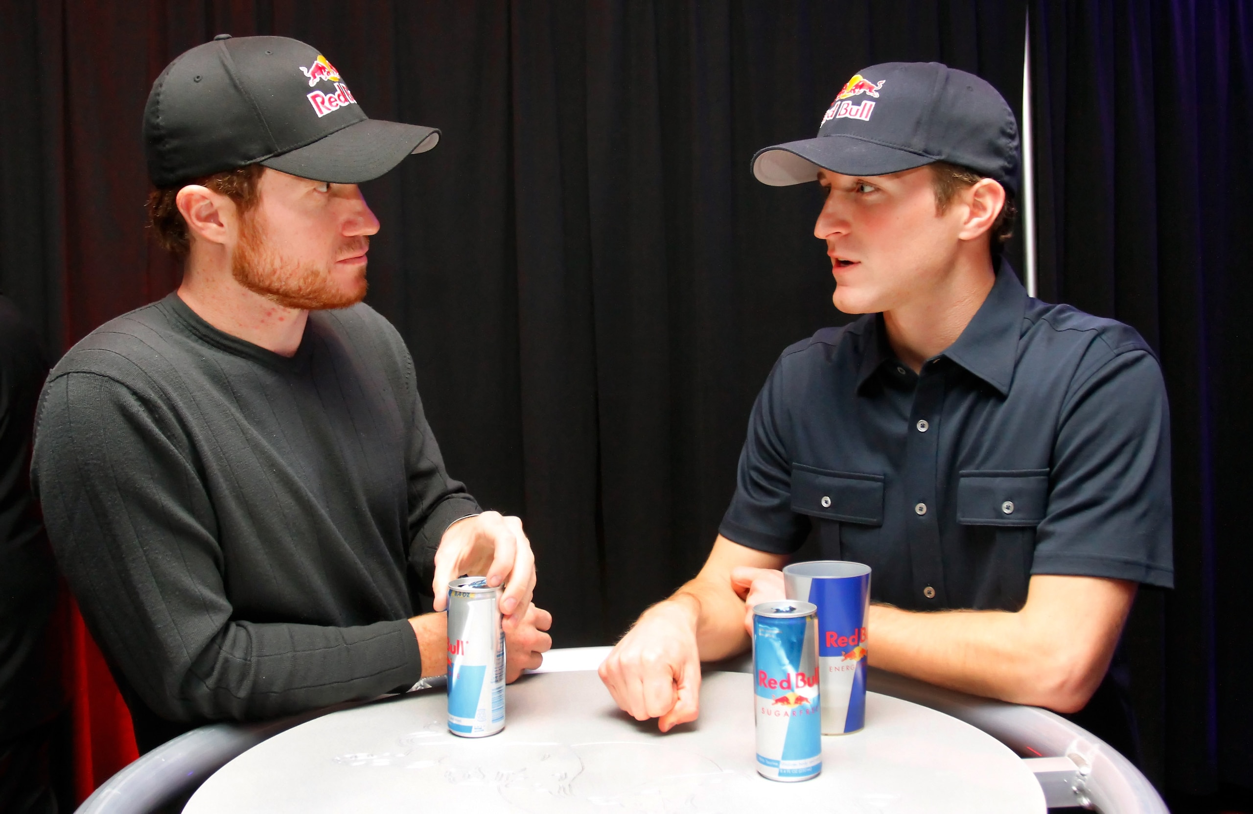 CHARLOTTE, NC - JANUARY 25:  Brian Vickers (L), driver of the #83 Red Bull Toyota, speaks with Kasey Kahne, driver of the #4 Red Bull Toyota, during the NASCAR Sprint Media Tour hosted by Charlotte Motor Speedway, held at Hilton University on January 25,