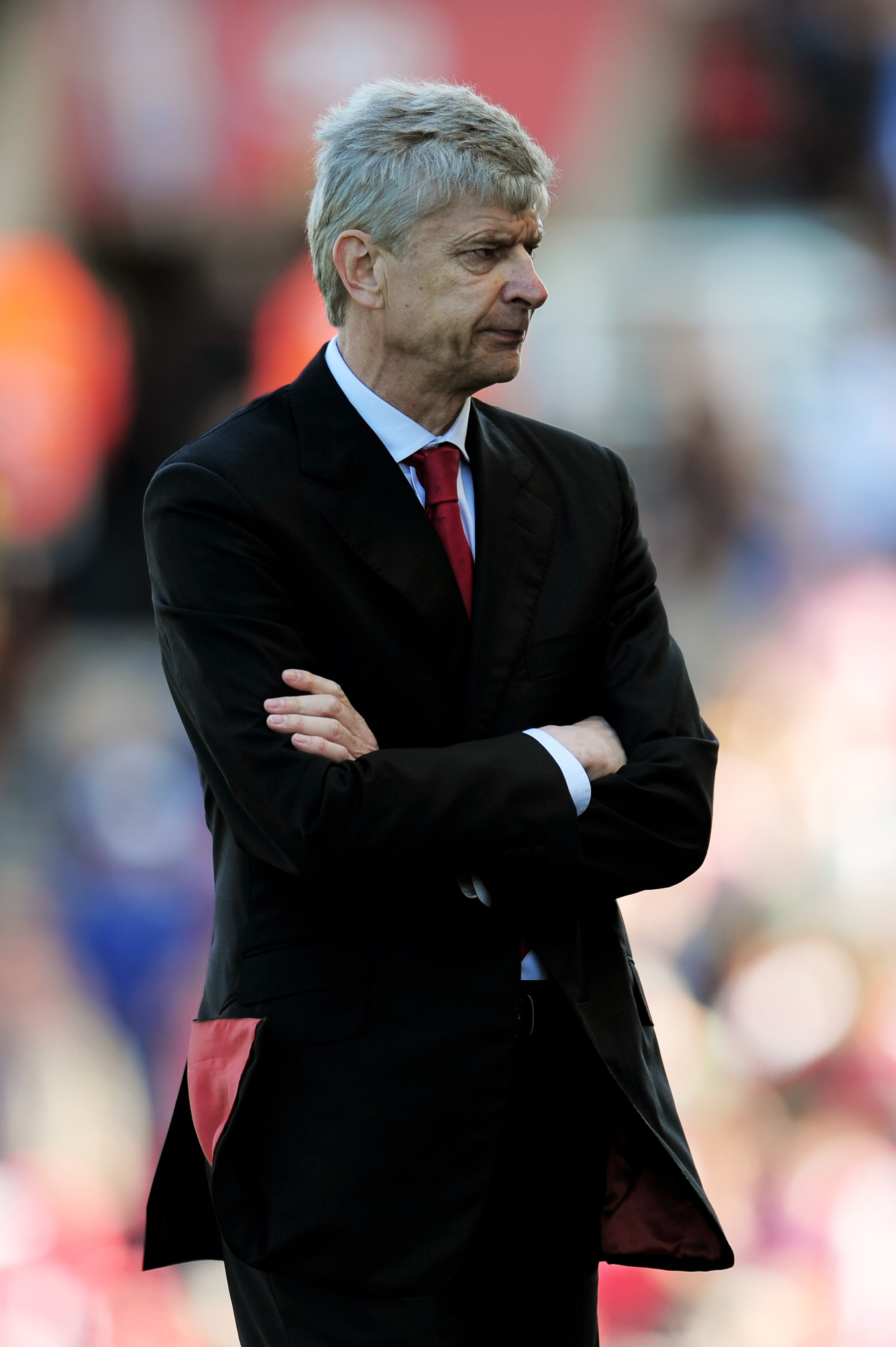 STOKE ON TRENT, ENGLAND - MAY 08:  A dejected Arsene Wenger the Arsenal manager looks on as his team head towards a 3-1 defeat during the Barclays Premier League match between Stoke City and Arsenal at the Britannia Stadium on May 8, 2011 in Stoke on Tren