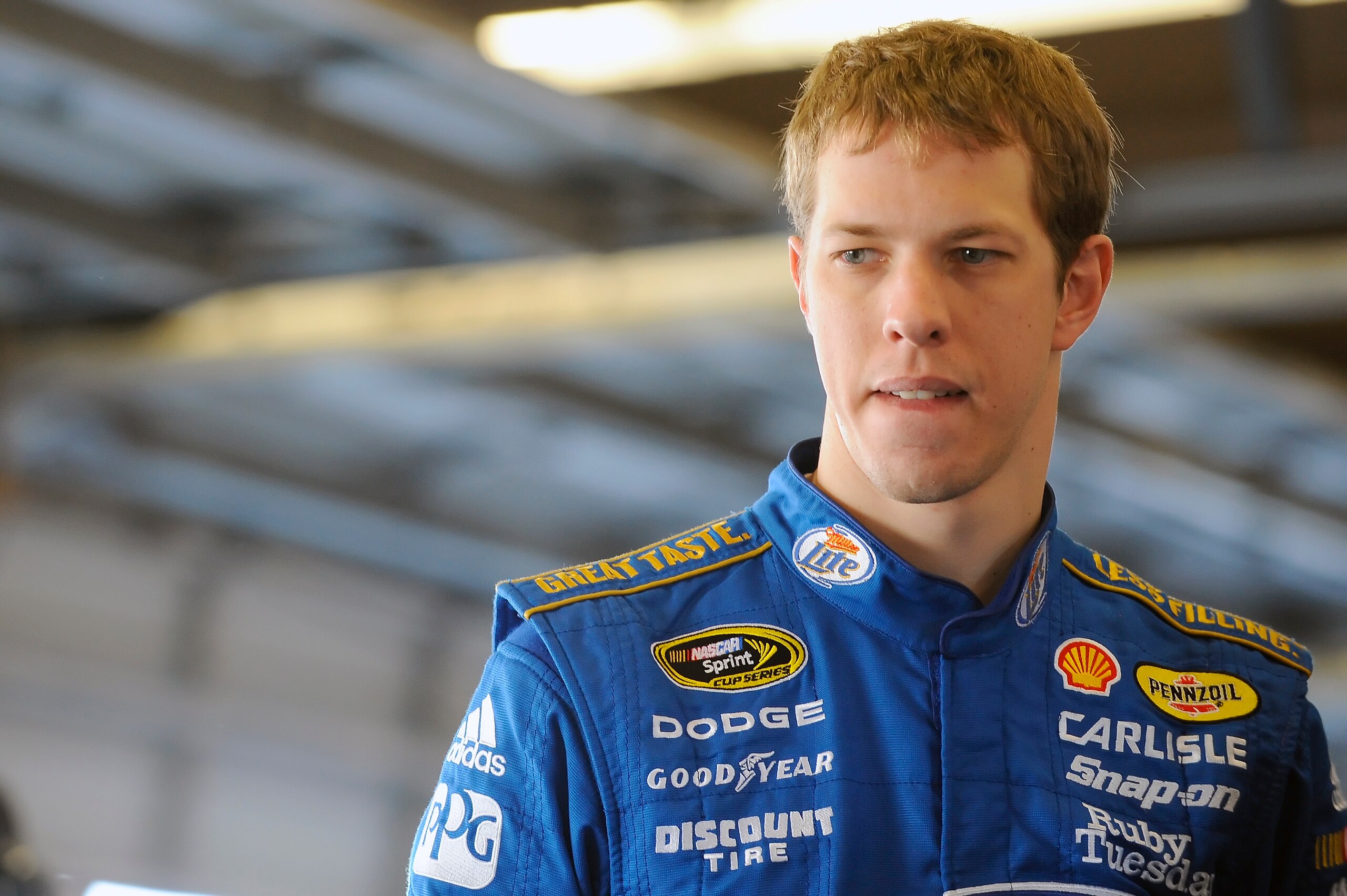 DAYTONA BEACH, FL - JANUARY 22:  Brad Keselowski, driver of the #2 Miller Lite Dodge, stands in the garage area during testing at Daytona International Speedway on January 22, 2011 in Daytona Beach, Florida.  (Photo by Jared C. Tilton/Getty Images for NAS