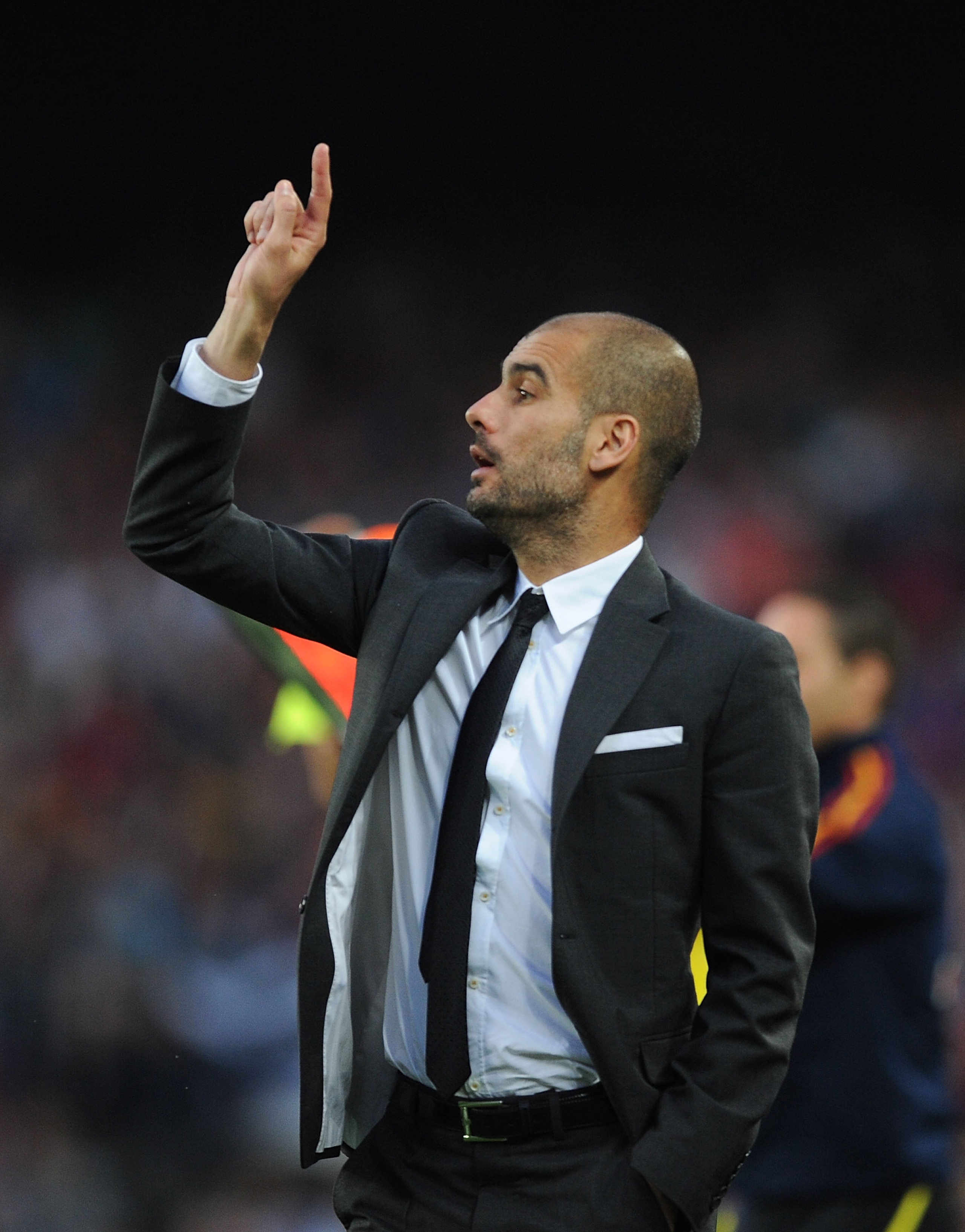 BARCELONA, SPAIN - MAY 08:  Head coach Josep Guardiola of Barcelona signals to a player during the La Liga match between Barcelona and Espanyol at Nou Camp on May 8, 2011 in Barcelona, Spain.  (Photo by Denis Doyle/Getty Images)