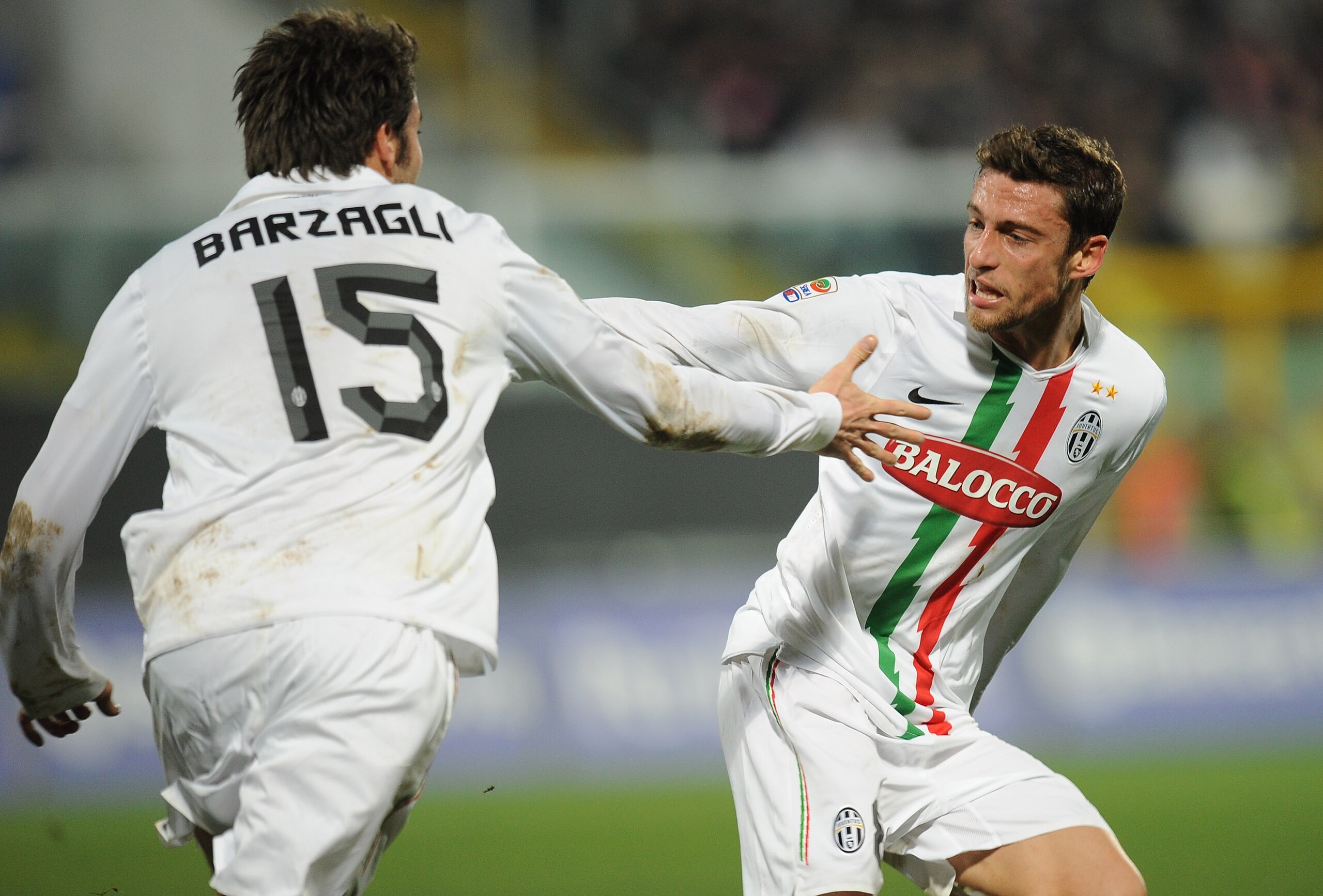 PALERMO, ITALY - FEBRUARY 02: Claudio Marchisio (R) of Juventus celebrates with his mate Andrea Barzagli after scoring his team's first goal during the Serie A match between US Citta di Palermo and Juventus FC at Stadio Renzo Barbera on February 2, 2011 PALERMO, ITALY - FEBRUARY 02: Claudio Marchisio (R) of Juventus celebrates with his mate Andrea Barzagli after scoring his team's first goal during the Serie A match between US Citta di Palermo and Juventus FC at Stadio Renzo Barbera on February 2, 2011