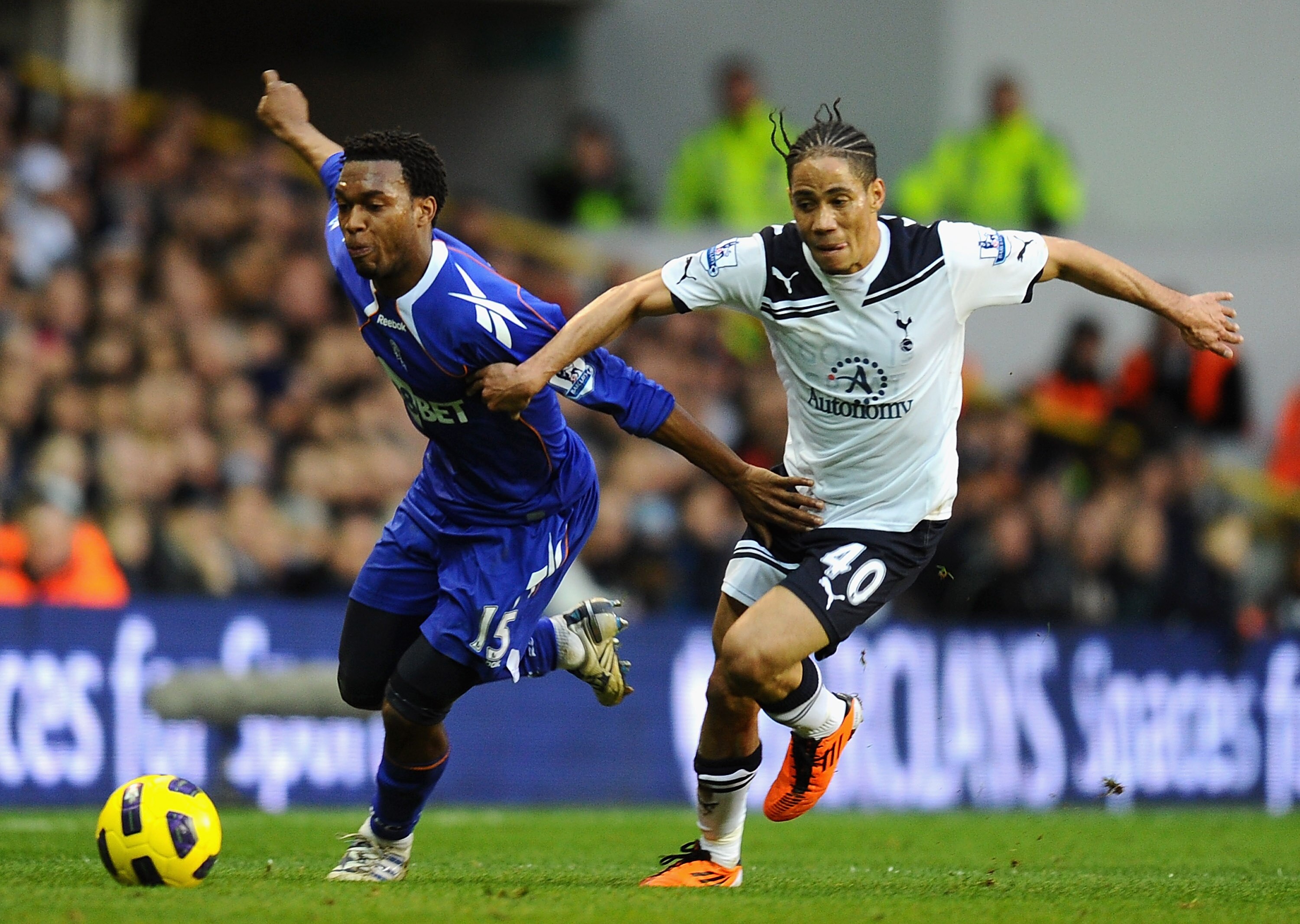 LONDON, ENGLAND - FEBRUARY 05:  Daniel Sturridge of Bolton Wanderers and Steven Pienaar of Tottenham Hotspur battle for the ball during the Barclays Premier League match between Tottenham Hotspur and Bolton Wanderers at White Hart Lane on February 5, 2011