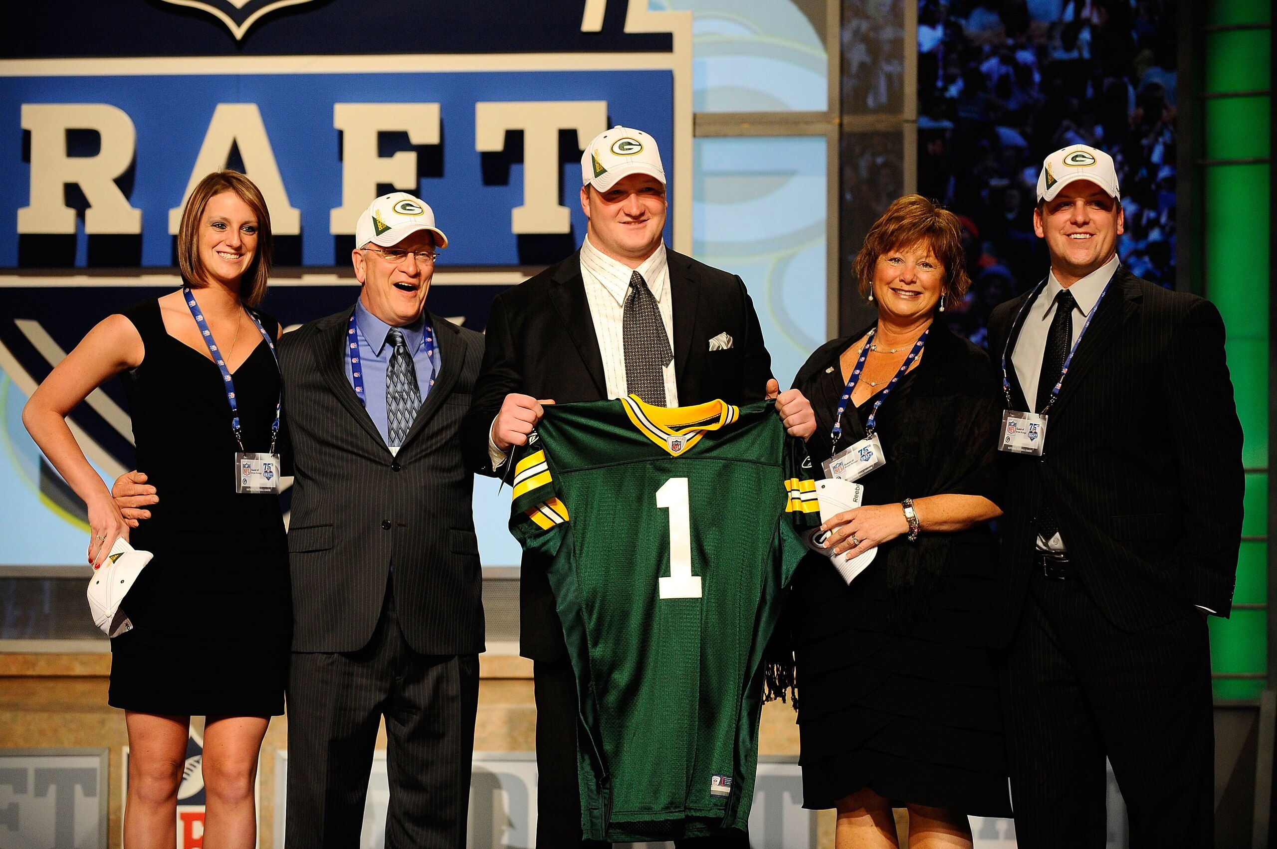 NEW YORK - APRIL 22:  Bryan Bulaga from the Iowa Hawkeyes holds up a Green Bay Packers jersey as he poses with friends and family after the Packers drafted him number 23 overall during the first round of the 2010 NFL Draft at Radio City Music Hall on Apri