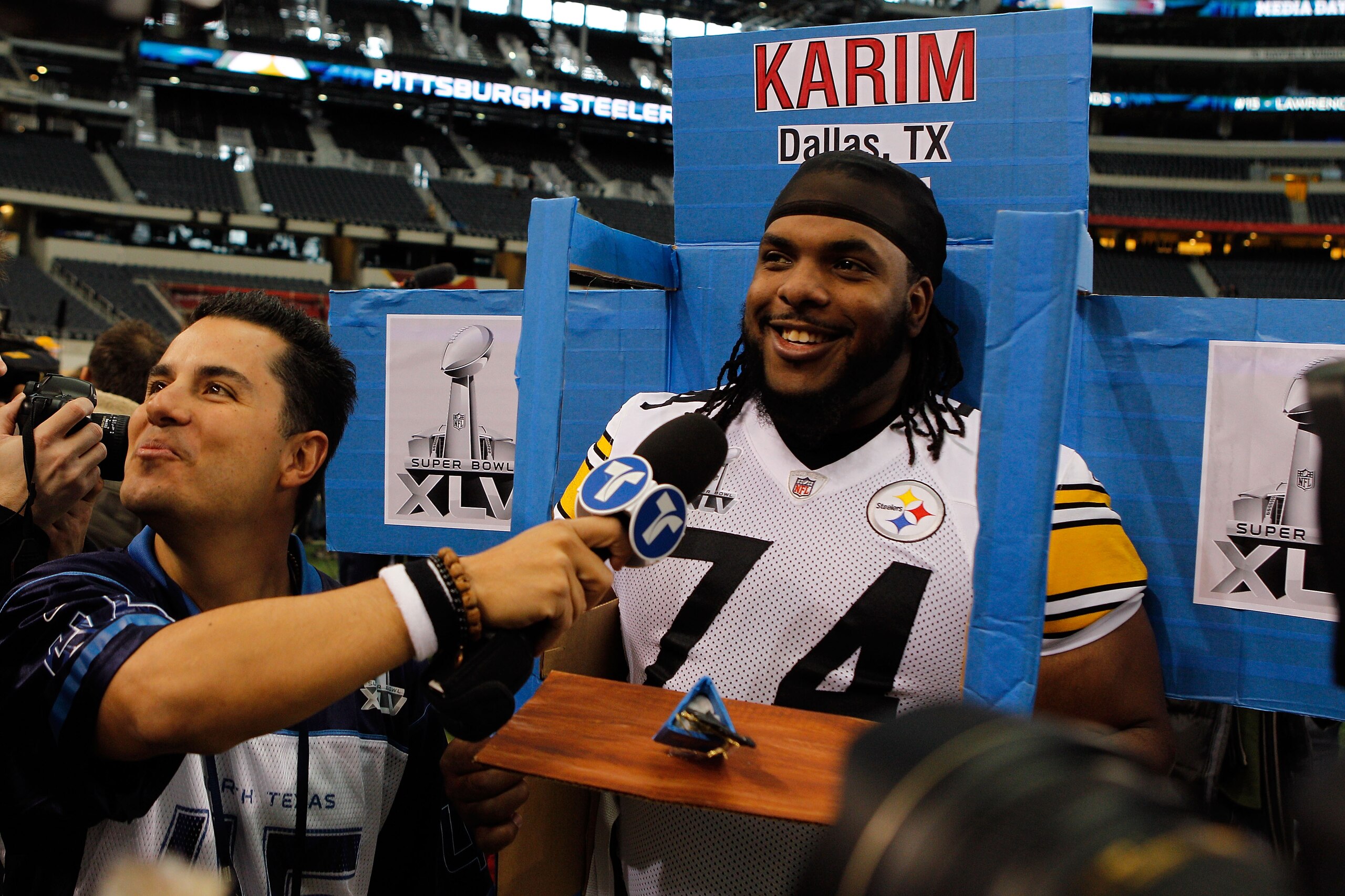 ARLINGTON, TX - FEBRUARY 01:  Willie Colon #74 of the Pittsburgh Steelers gets into a box brought in by a member of Telemundo during Super Bowl XLV Media Day ahead of Super Bowl XLV at Cowboys Stadium on February 1, 2011 in Arlington, Texas. The Pittsburg