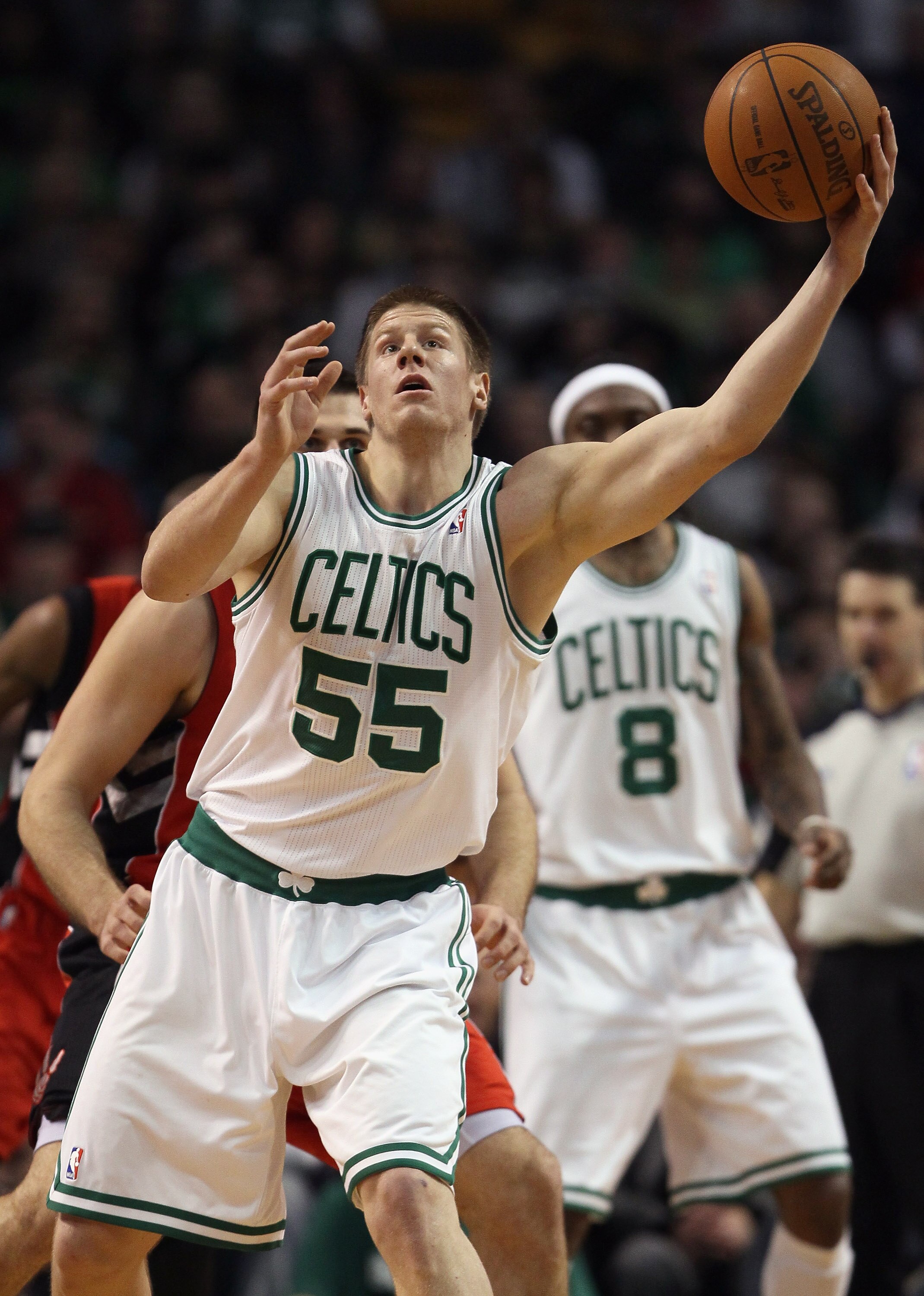 BOSTON, MA - JANUARY 07:  Luke Harangody #55 of the Boston Celtics regains control of the ball in the second half against the Toronto Raptors on January 7, 2011 at the TD Garden in Boston, Massachusetts. The Celtics defeated the Raptors 122-102. NOTE TO U