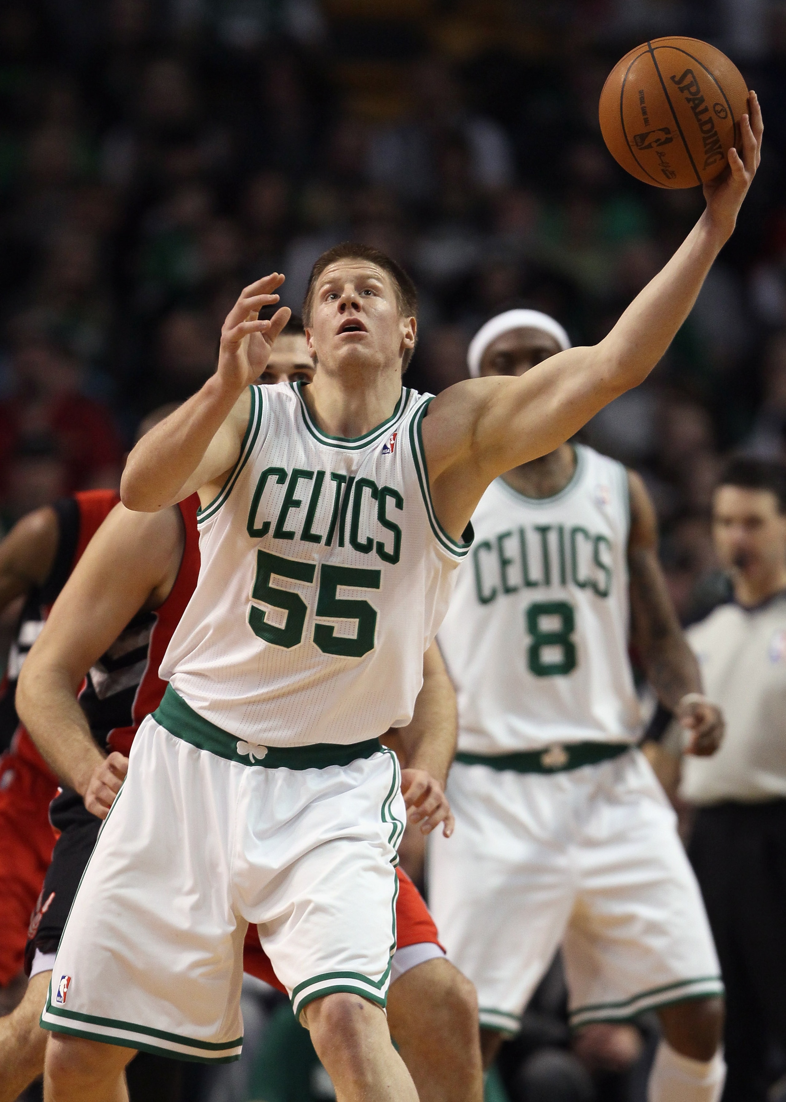 BOSTON, MA - JANUARY 07:  Luke Harangody #55 of the Boston Celtics regains control of the ball in the second half against the Toronto Raptors on January 7, 2011 at the TD Garden in Boston, Massachusetts. The Celtics defeated the Raptors 122-102. NOTE TO U
