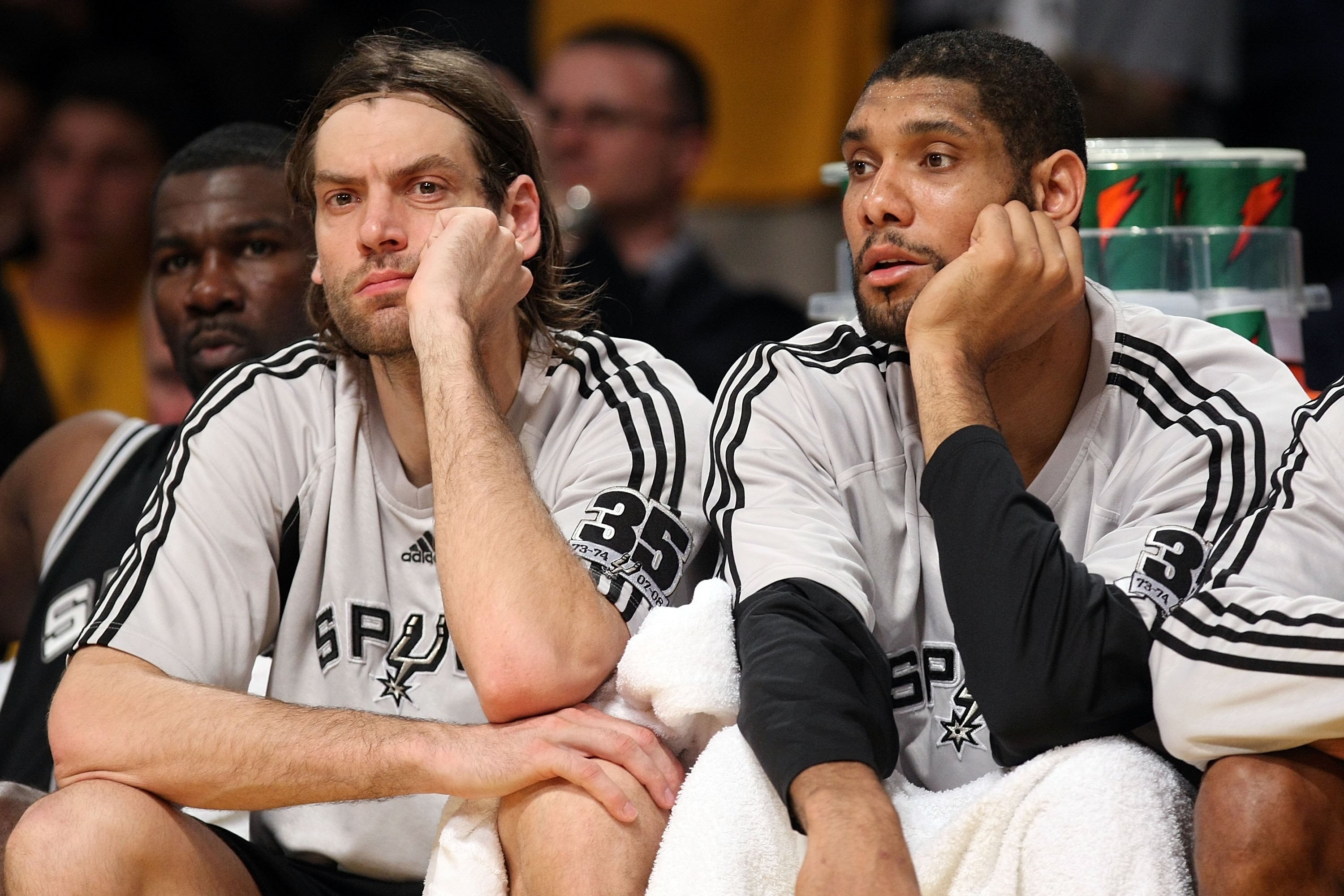 LOS ANGELES, CA - MAY 23:  (L-R) Fabricio Oberto #7 and Tim Duncan #21 of the San Antonio Spurs sit on the bench in the final minutes against the Los Angeles Lakers in Game Two of the Western Conference Finals during the 2008 NBA Playoffs on May 23, 2008