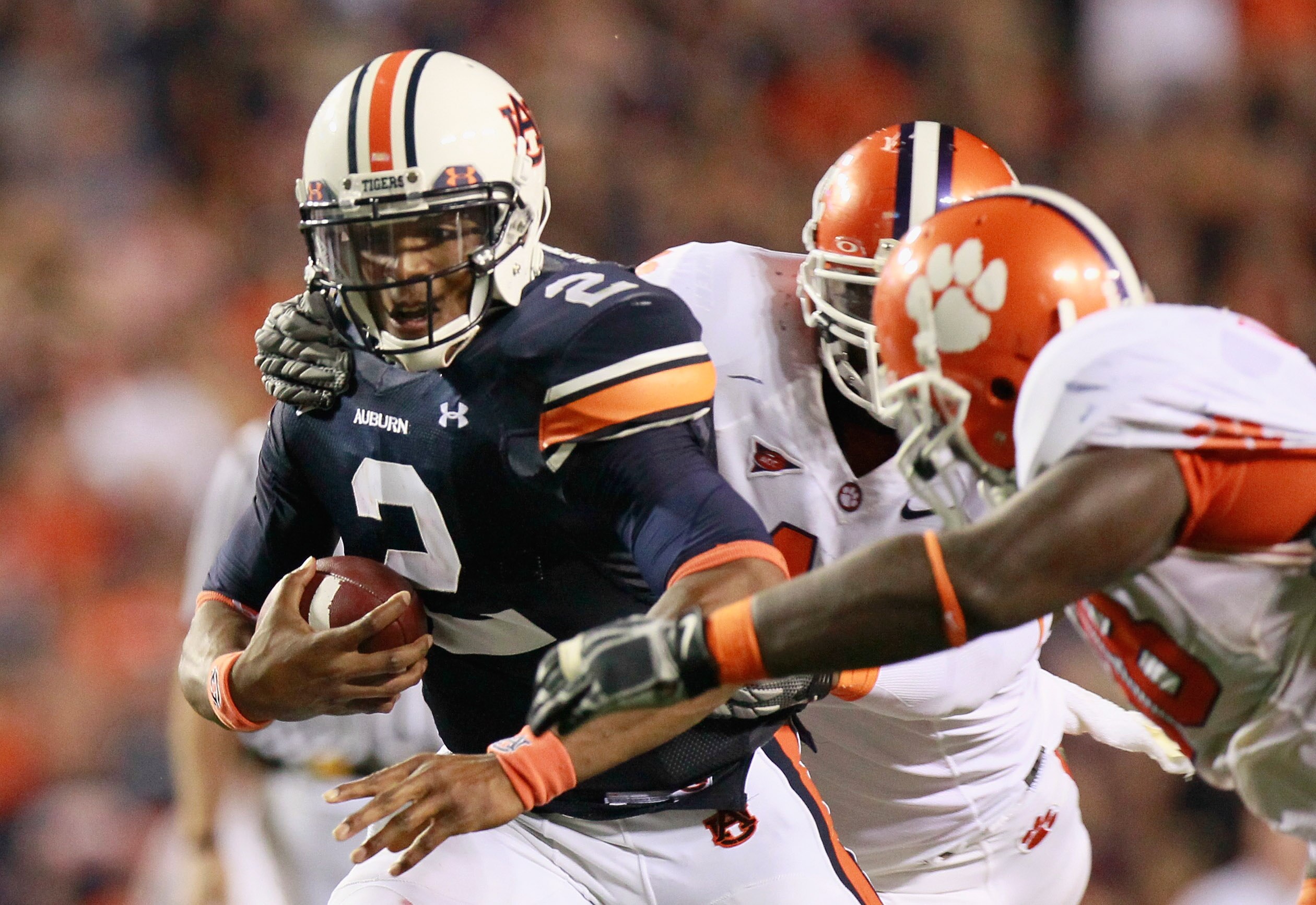 AUBURN, AL - SEPTEMBER 18:  Quarterback Cameron Newton #2 of the Auburn Tigers rushes upfield in overtime against the Clemson Tigers at Jordan-Hare Stadium on September 18, 2010 in Auburn, Alabama.  (Photo by Kevin C. Cox/Getty Images)