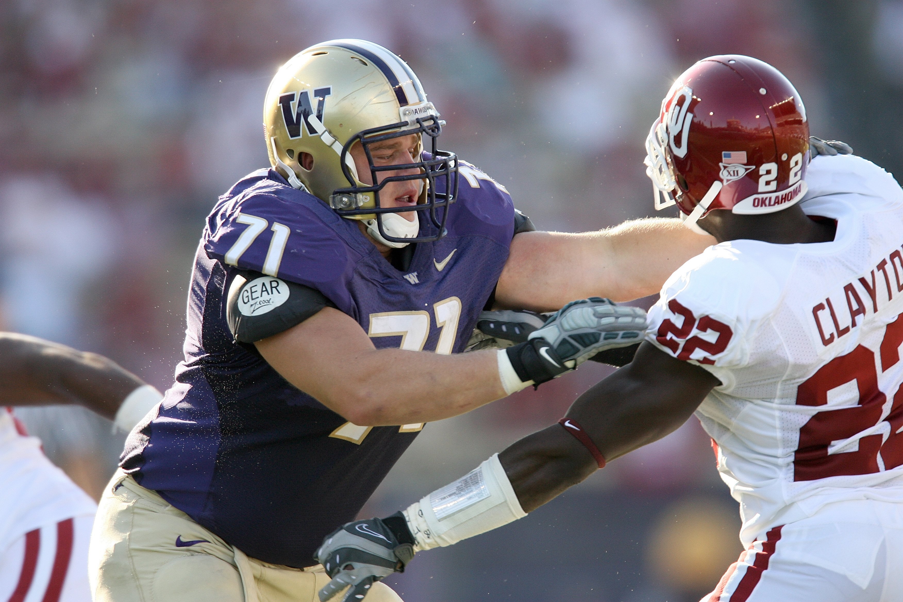 SEATTLE - SEPTEMBER 13:  Cody Habben #71 of the Washington Huskies blocks Keenan Clayton #22 of the Oklahoma Sooners during the game on September 13, 2008 at Husky Stadium in Seattle, Washington. The Sooners defeated the Huskies 55-14.(Photo by Otto Greul
