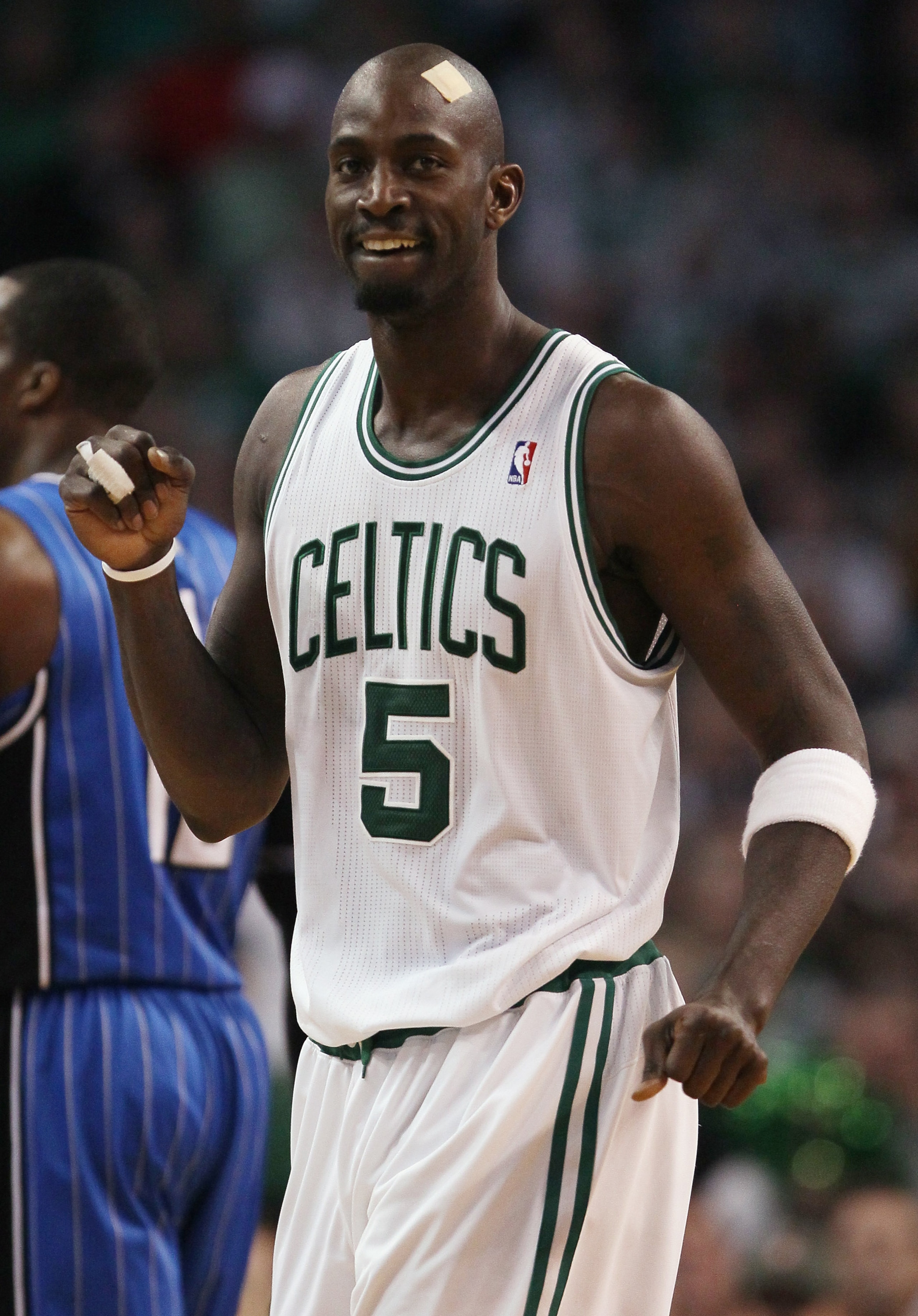 BOSTON, MA - FEBRUARY 06: Kevin Garnett #5 of the Boston Celtics celebrates in the first half against the Orlando Magic on February 6, 2011 at the TD Garden in Boston, Massachusetts. The Celtics defeated the Magic 91-80. NOTE TO USER: User expressly ackn BOSTON, MA - FEBRUARY 06: Kevin Garnett #5 of the Boston Celtics celebrates in the first half against the Orlando Magic on February 6, 2011 at the TD Garden in Boston, Massachusetts. The Celtics defeated the Magic 91-80. NOTE TO USER: User expressly ackn