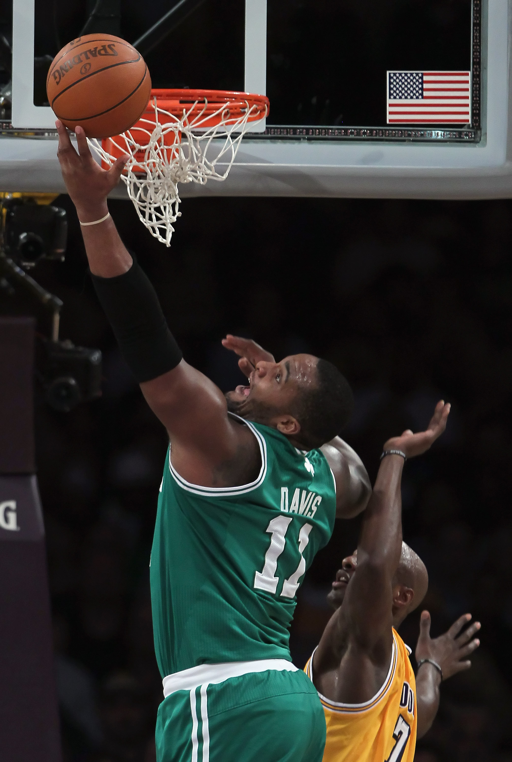 LOS ANGELES, CA - JANUARY 30:  Glen Davis #11 of the Boston Celtics drives to the basket past Lamar Odom #7 of the Los Angeles Lakers in the first half at Staples Center on January 30, 2011 in Los Angeles, California. The Celtics defeated the Lakers 109-9