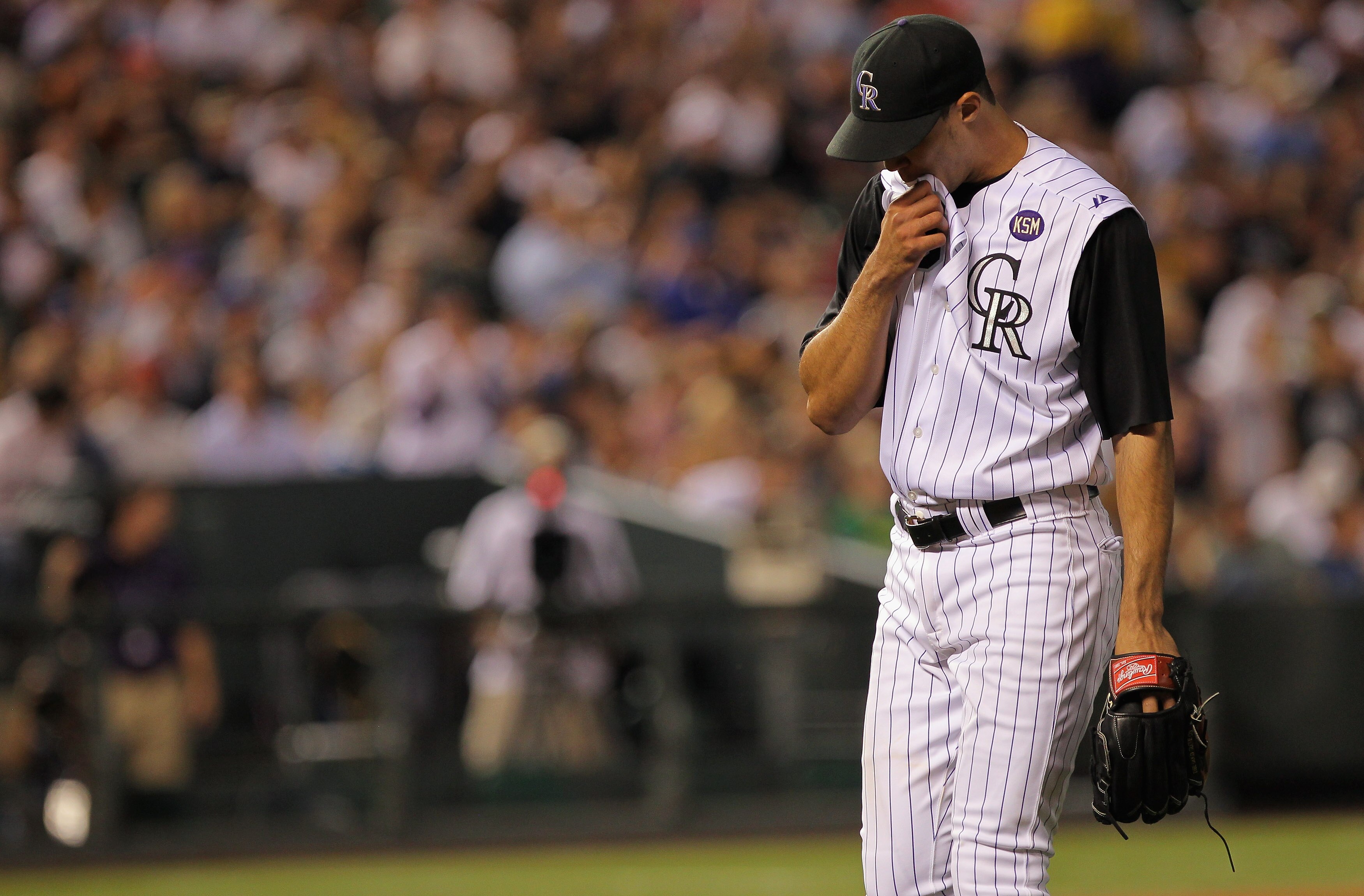 DENVER - SEPTEMBER 27:  Starting pitcher Ubaldo Jimenez #38 of the Colorado Rockies heads for the dugout after the seventh inning against the Los Angeles Dodgers at Coors Field on September 25, 2010 in Denver, Colorado. Jiimenez failed to earn his 20th wi